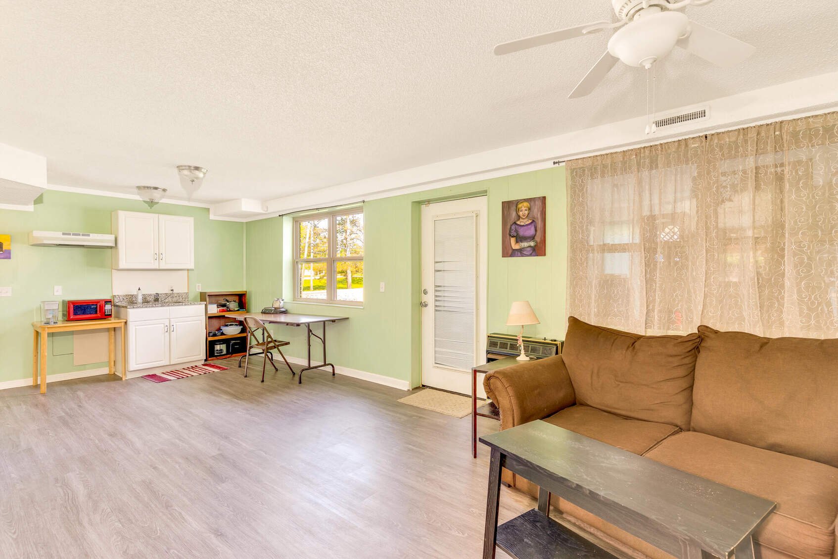 Finished basement at 1701 Ray Jo Circle with a kitchenette and its own exterior door