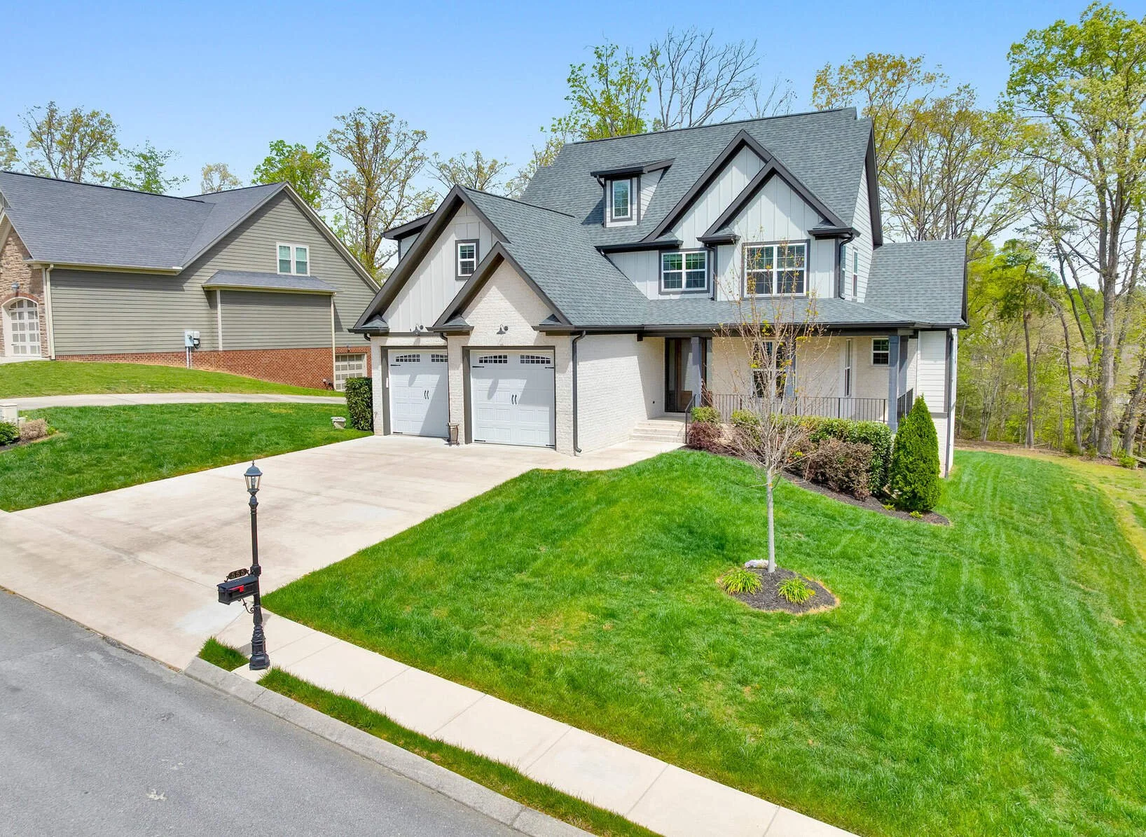 555 Kashaya Lane in Lennox Pointe, Soddy Daisy, with covered front porch and two-car garage