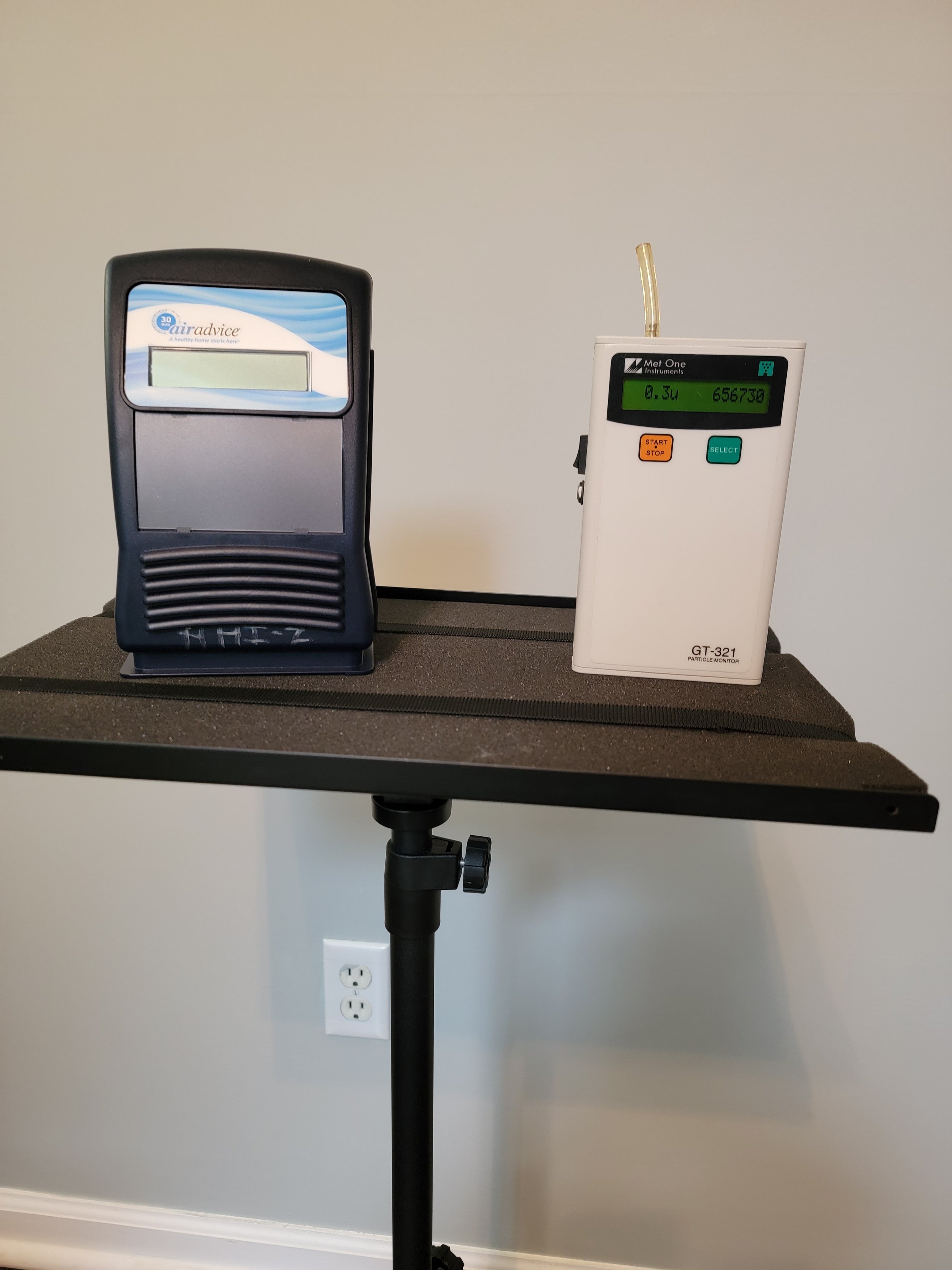 Air quality monitoring devices on a stand