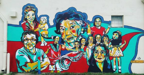 Women Who Mold Us 
102 E 21st St N. 
July 2018 
8' x 17' 
 
Celebrating the ordinary, amazing things that the women in all of our lives do to shape us. This mural features 13 portraits of 11 different women. The subjects are all from the same family 