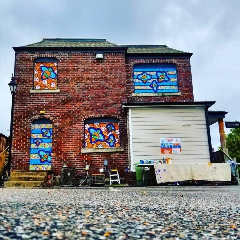 Honeybees 
3700 E Douglas Ave 
September 2019 
4 smaller murals 
 
The third and most recent contribution to Avenue Art Days. Four quilt-like honeybee murals adorn the north side of Clifton Square's center building. In collaboration with Kevin Stanbe
