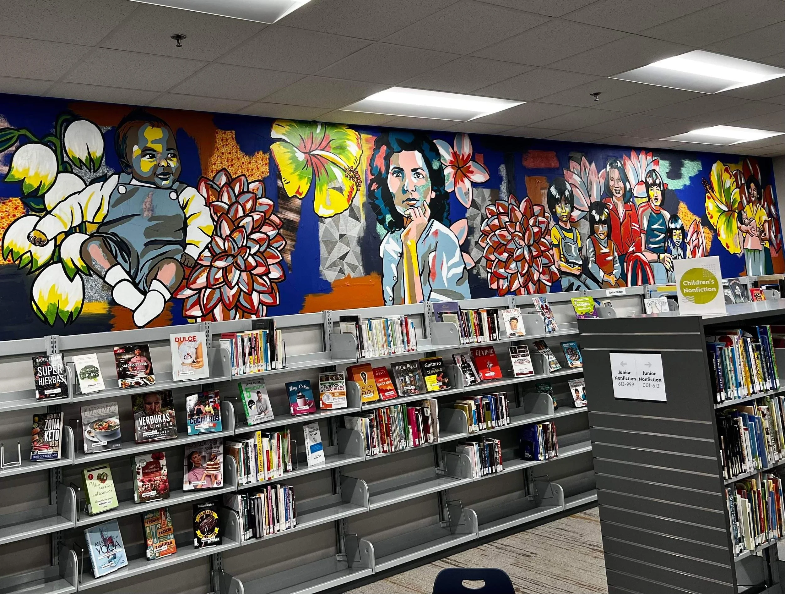 Evergreen Library and Resource Center
Neighborhood History
100 feet in length, spanning two walls
March 2022

This project is was a love letter to an historic neighborhood in Wichita. It layers fabric and paint as well as a collage style to show all 