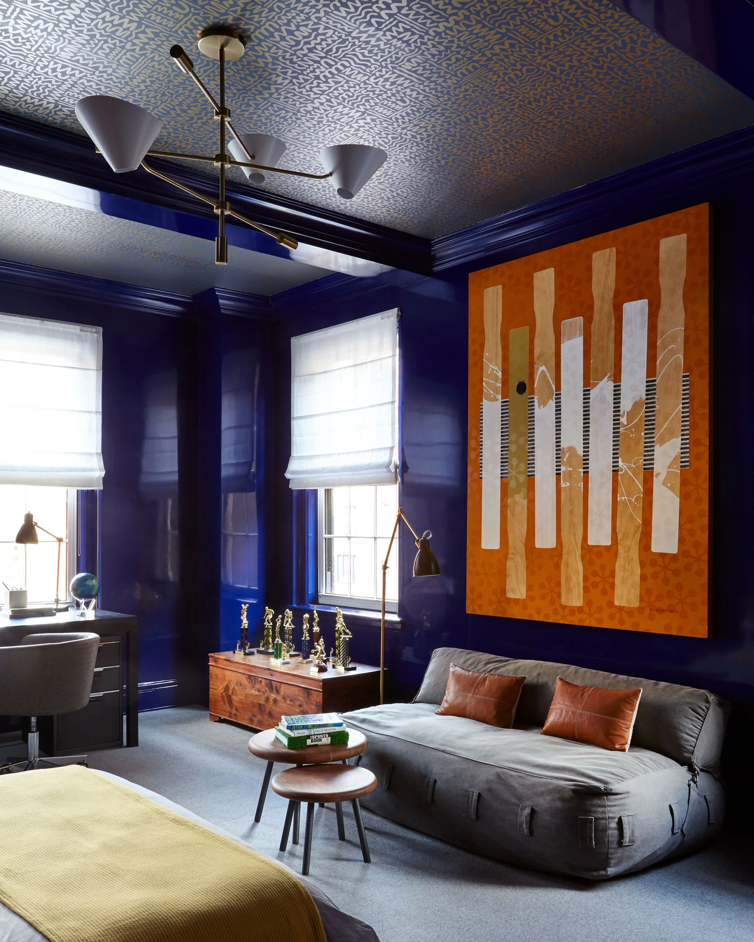 Bedroom design by Elaine Santos Design featuring blue walls and lounge furniture