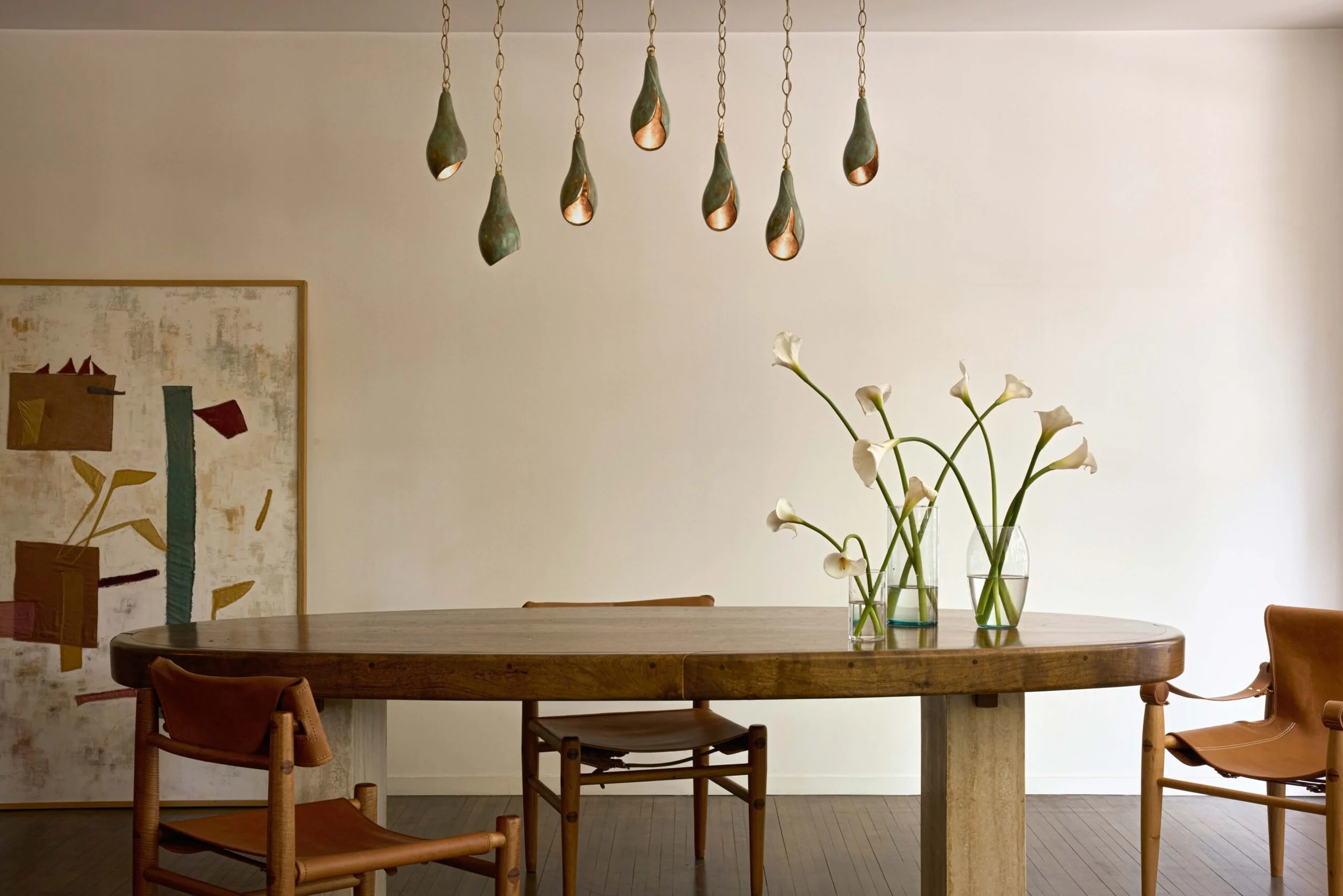 Dining table and chairs styled with lily ceiling lamp from L'Aviva Home in Mexico City