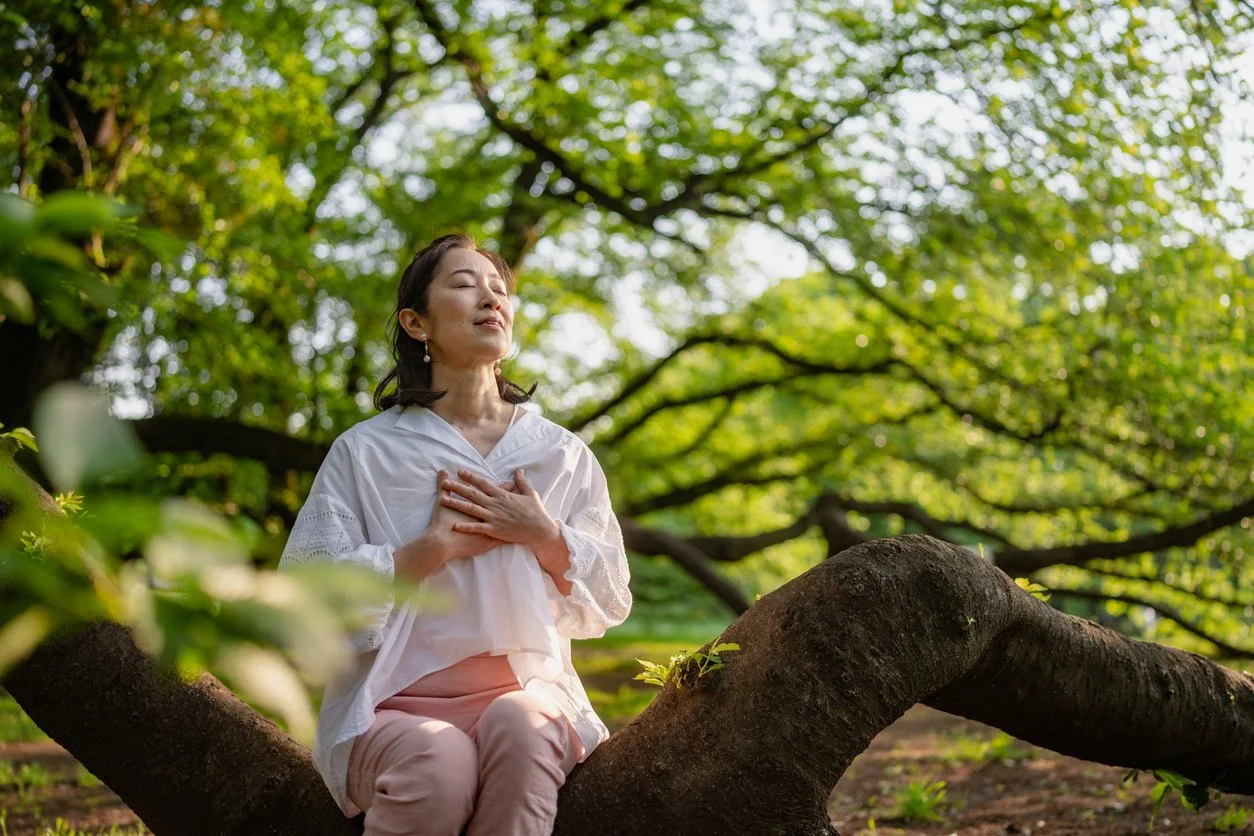 a woman holds heart website pic.jpg