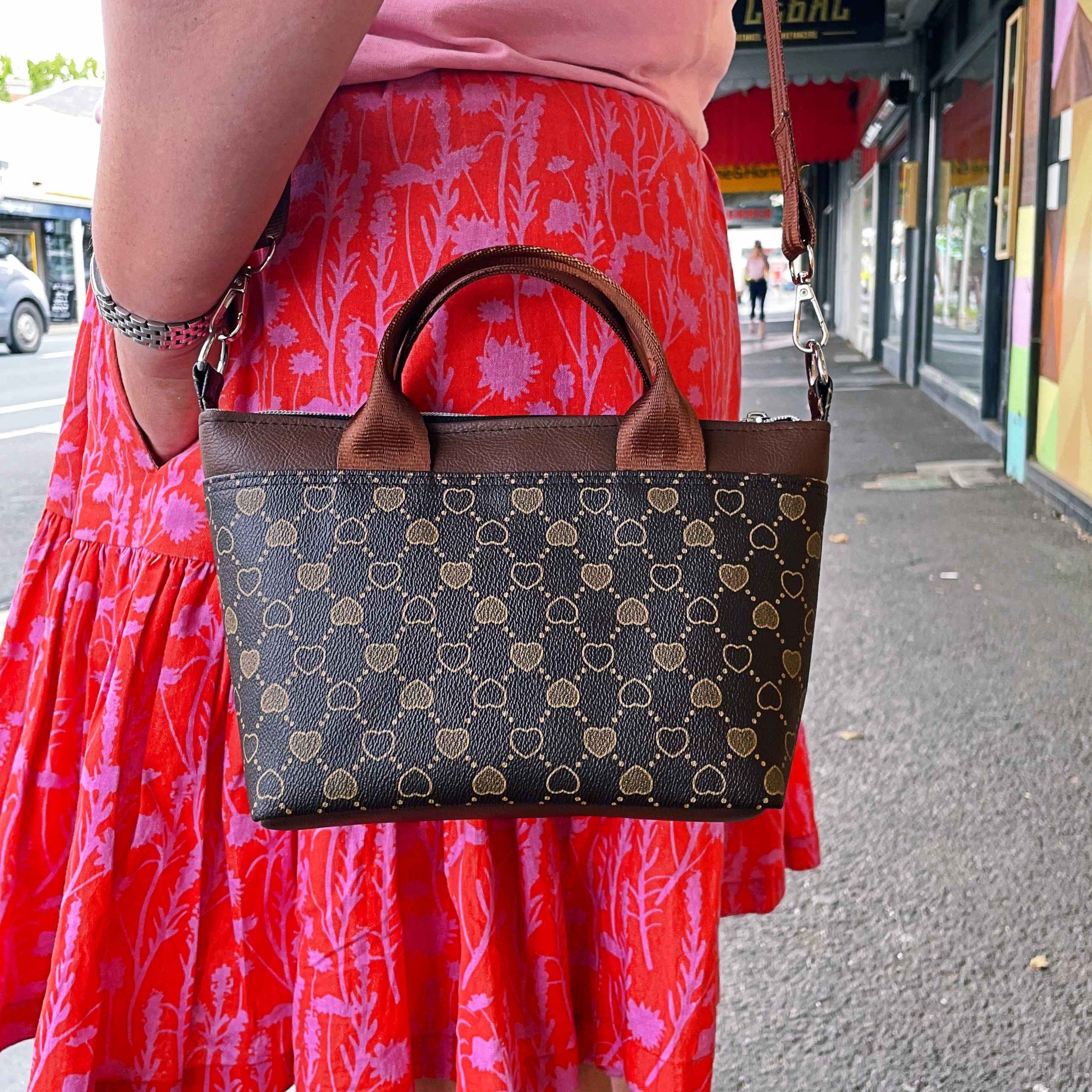 Wear it your way. 
Grab handles or adjustable crossbody strap