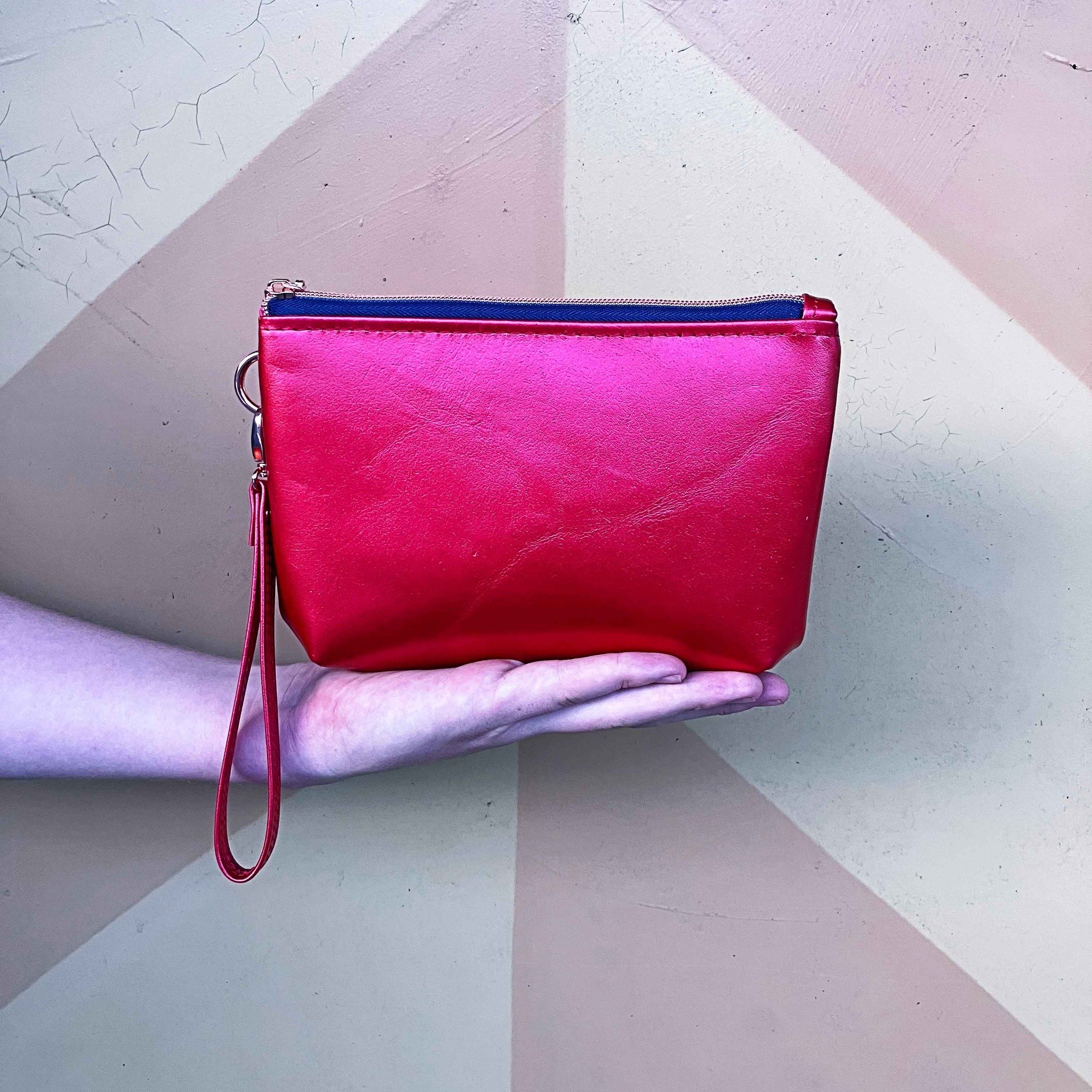 What l like about you! 
This wristlet / bag is everything l love in one. 
Compact, practical, stunning one of kind leather finish, and can been worn over the shoulder with a detachable strap.