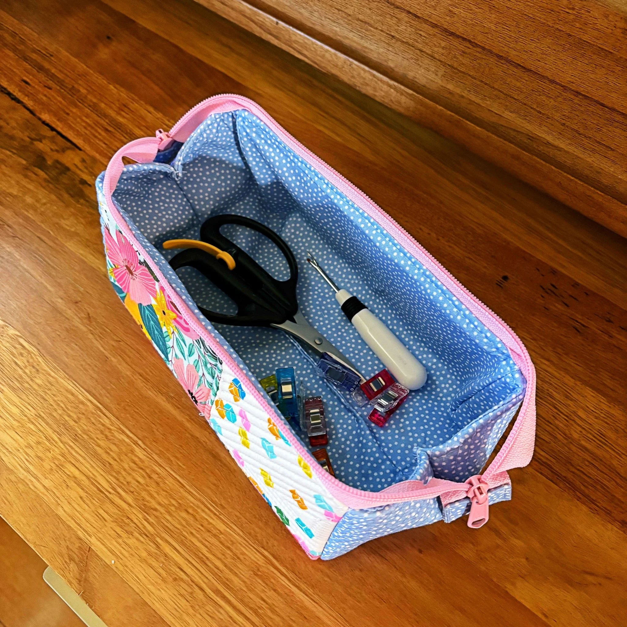 Open Wide. 
A pouch that open wide enough for you to see everything in it and then compactly zipped up.