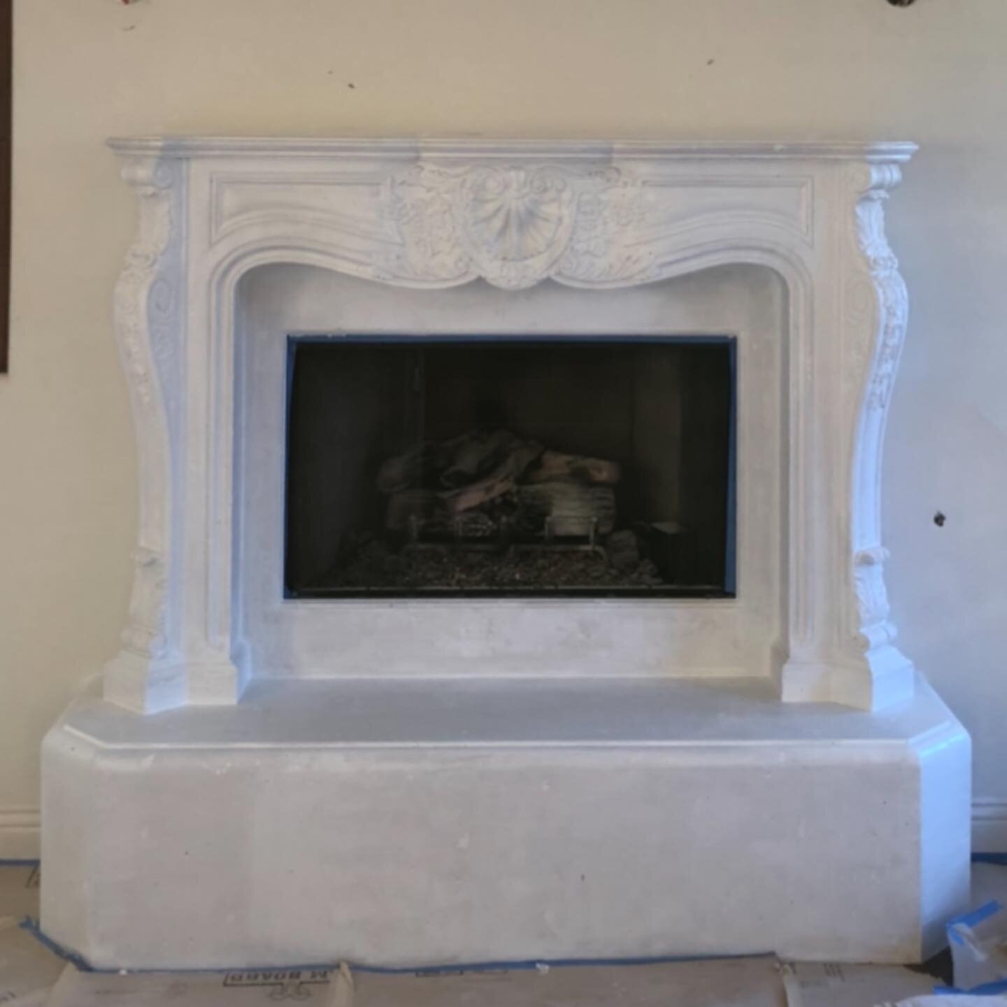 The original color of this fireplace was a terracotta. The clients thought about possibly removing it before we discussed giving it a lime stone finish. Transformation from primer white to final finish.