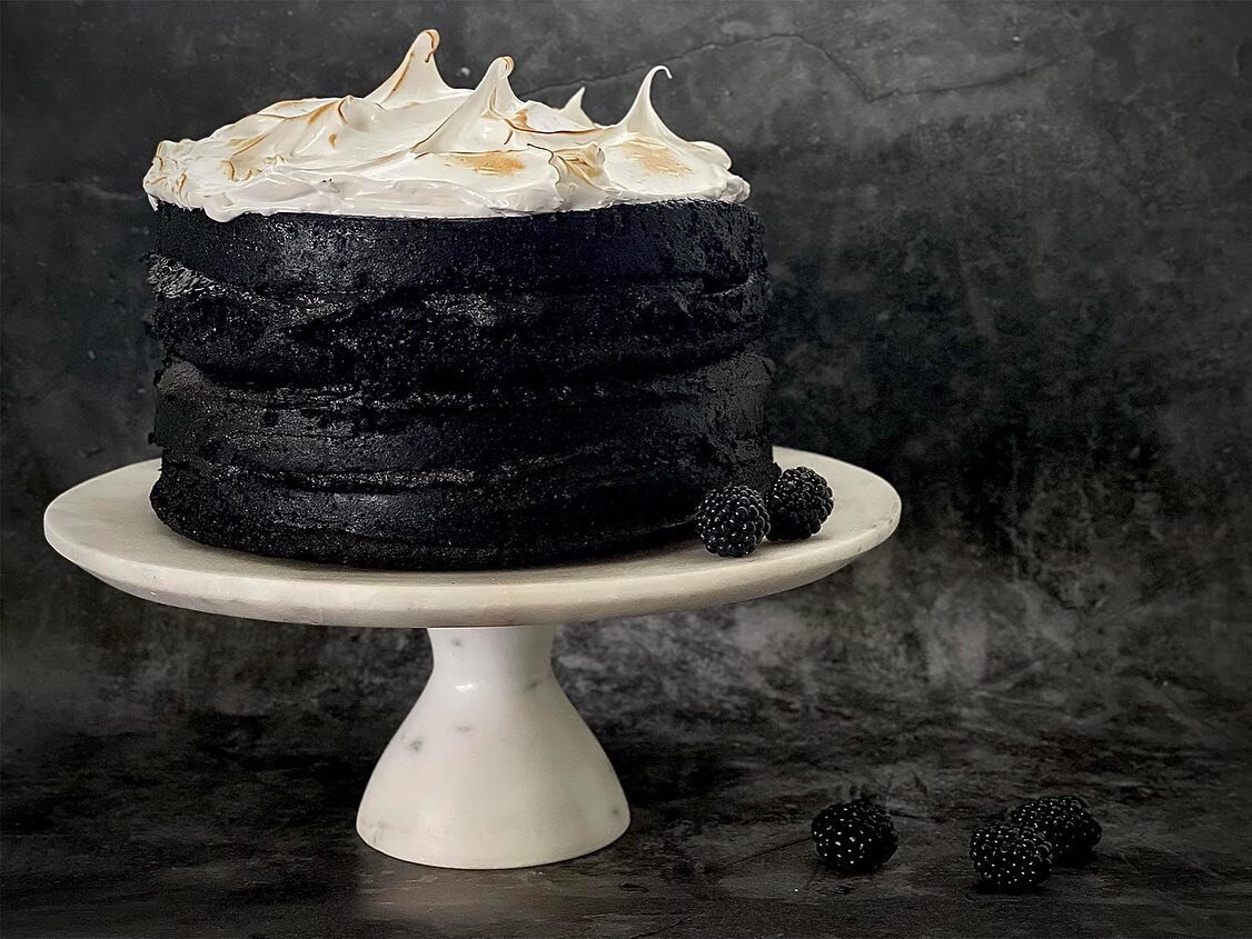 Black Cocoa Cloud Cake With Black Mascarpone Icing

No doubt, one of our most dramatic creations, this cake is a real statement with its highly contrasting black and white tones. The pairing of soft, dark chocolate sponge with that fluffy, melt-in-th