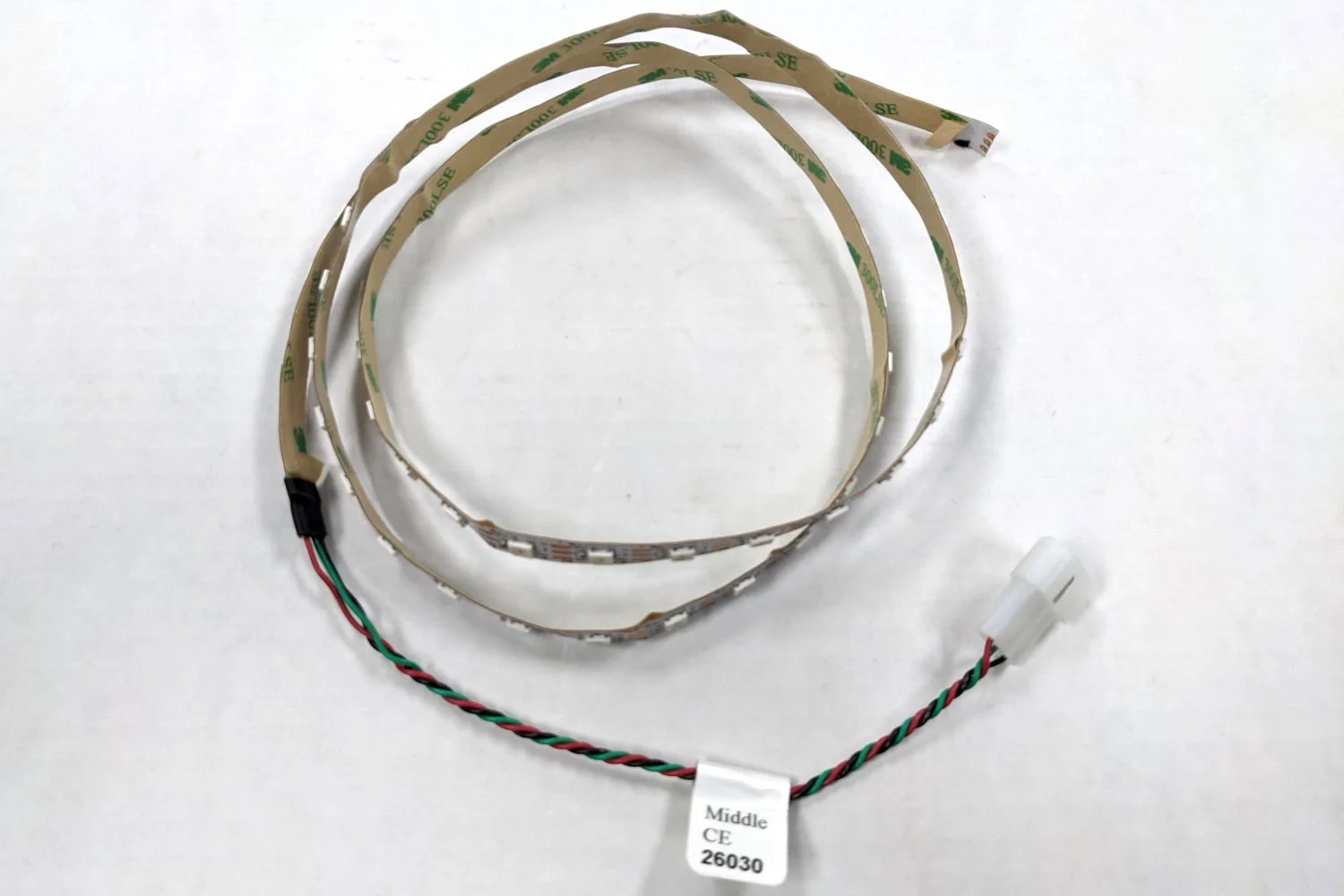 Spiral LED light strip with wired connector and a white label reading 'Middle CE 26030' on white background.