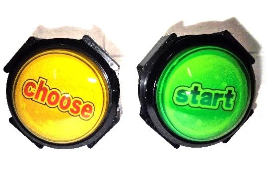 Two circular game buttons, one yellow with the word "choose" in red, and one green with the word "start" in green, used as game controls.
