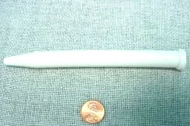 White spike lying horizontally on a white background.