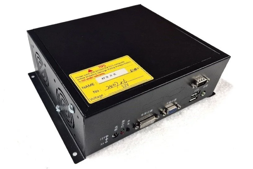 Black metal electronic device with various ports including a VGA port, USB port, and audio jack, placed on a white surface.