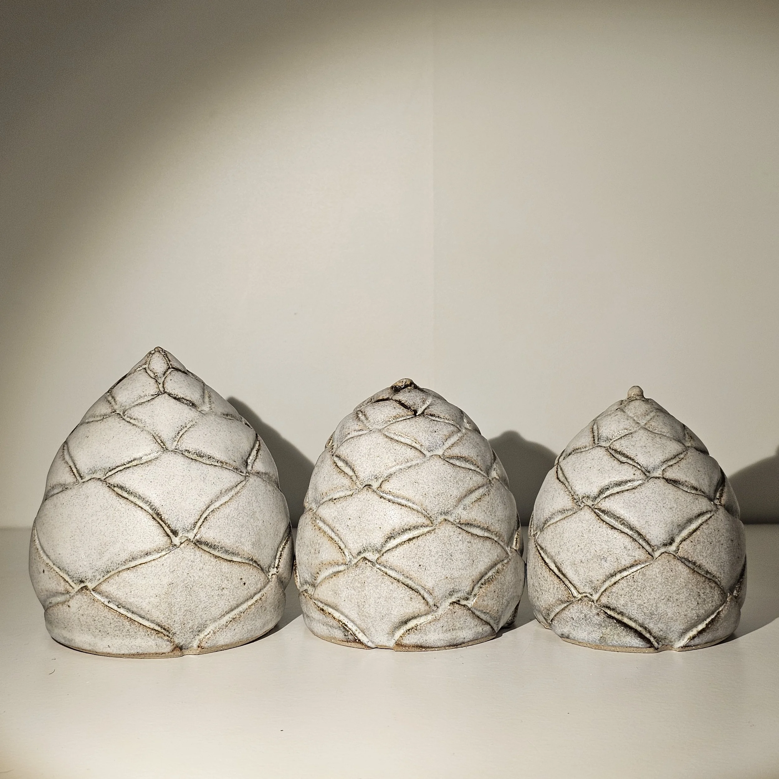 James T Smith Seventh Circle Artworks Aesthetics set of three pine cones dolomite glaze 1.jpg