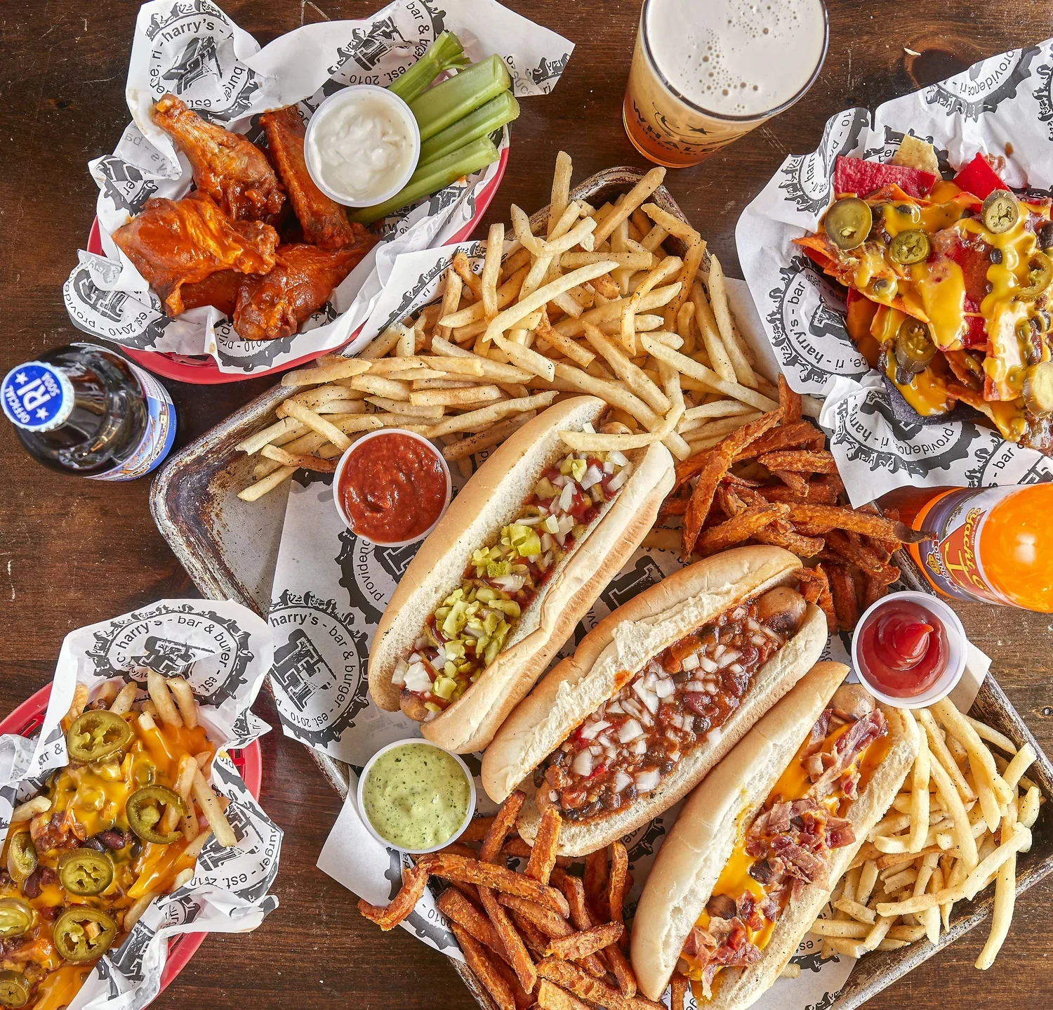 Harry'sBurgerBar_HotDogTriowithNachos&Wings.webp