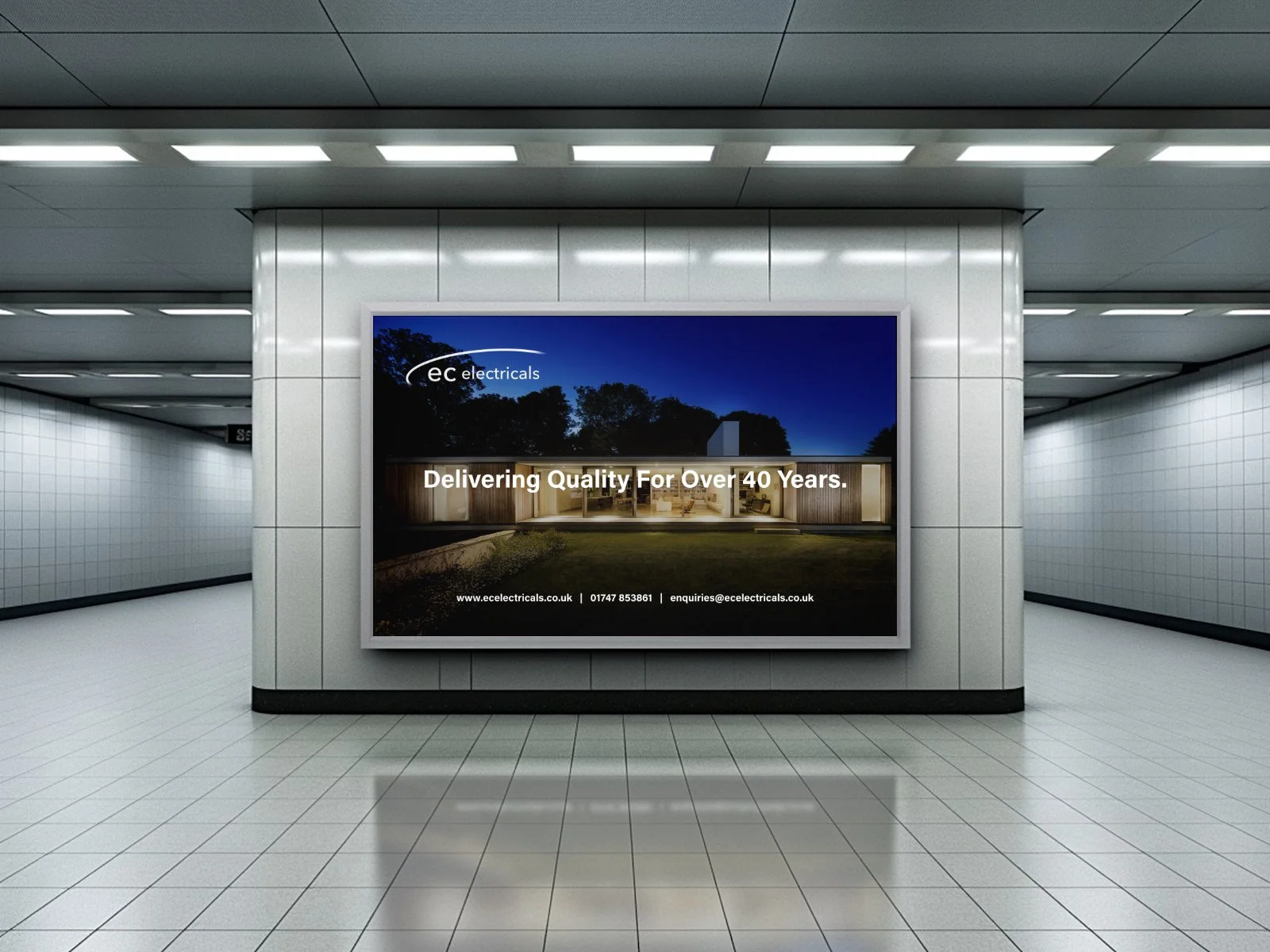 An advert in a well lit train station.