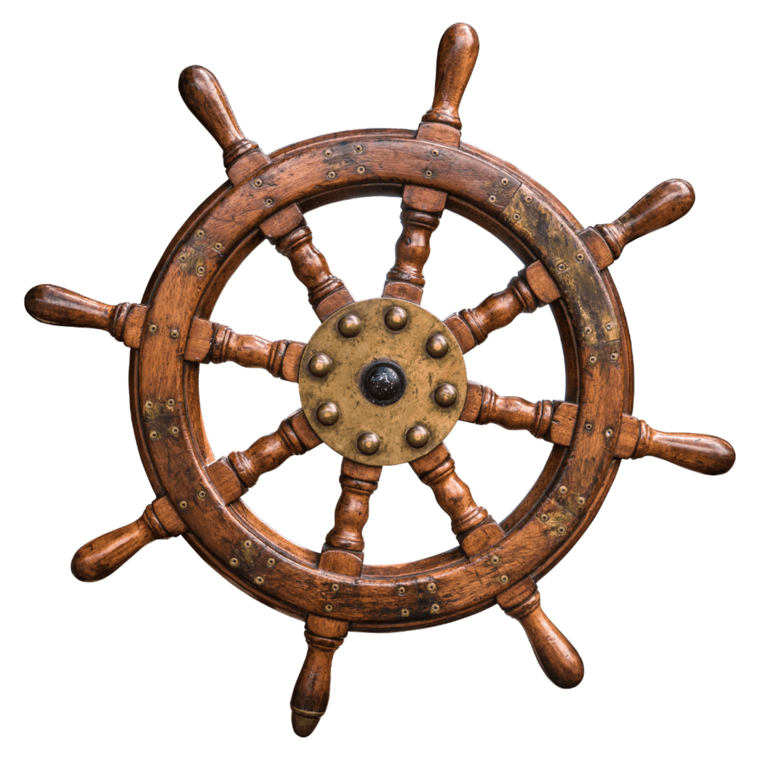Wooden ship steering wheel with brass and black center, used for navigation on a boat or ship.