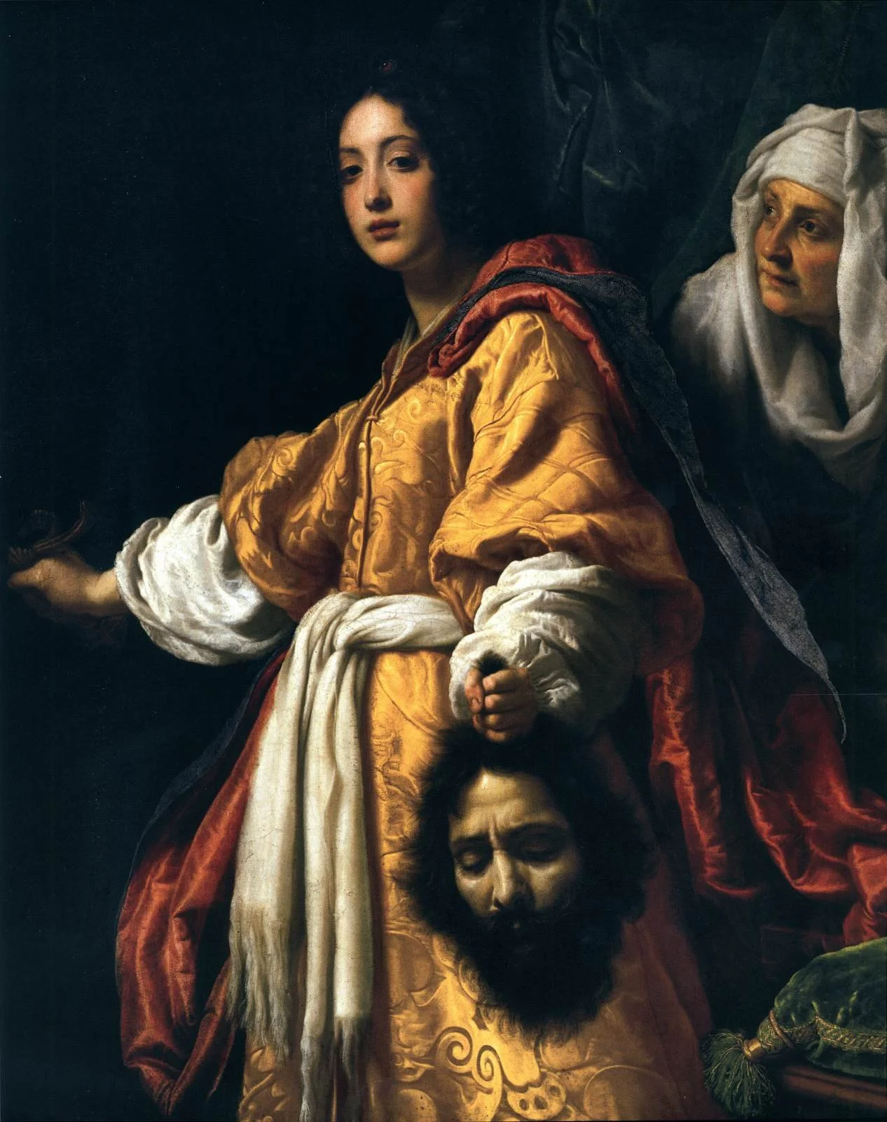 Baroque painting showing a young woman holding a sword, with a woman behind her wearing a white headscarf and an older man's head lowered, with a somber expression.