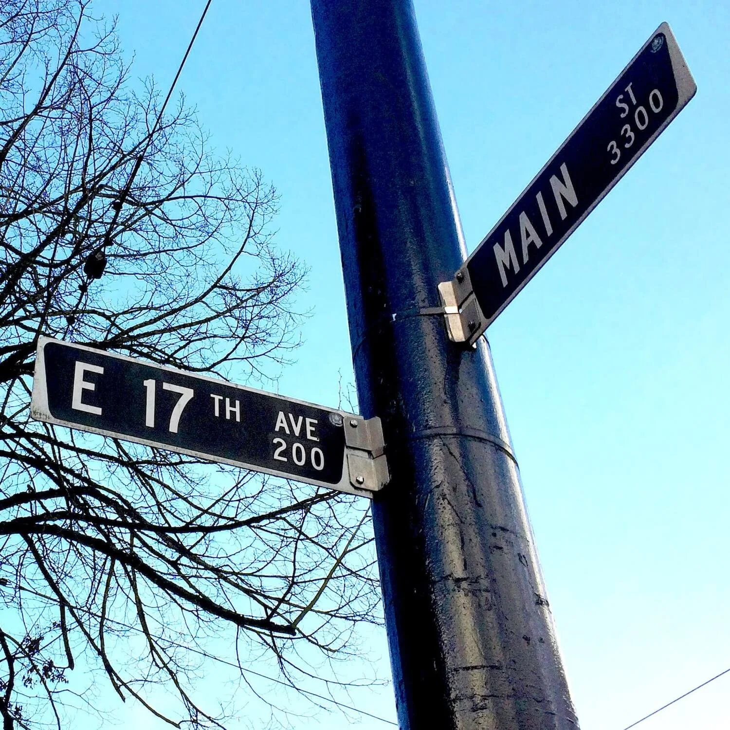 17th Ave and Main Street Sign Post