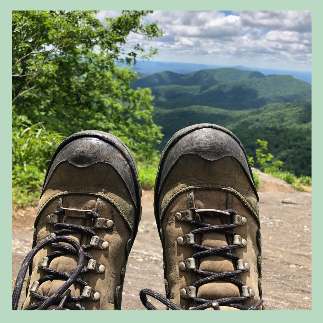 Hiking boots atop a mountain