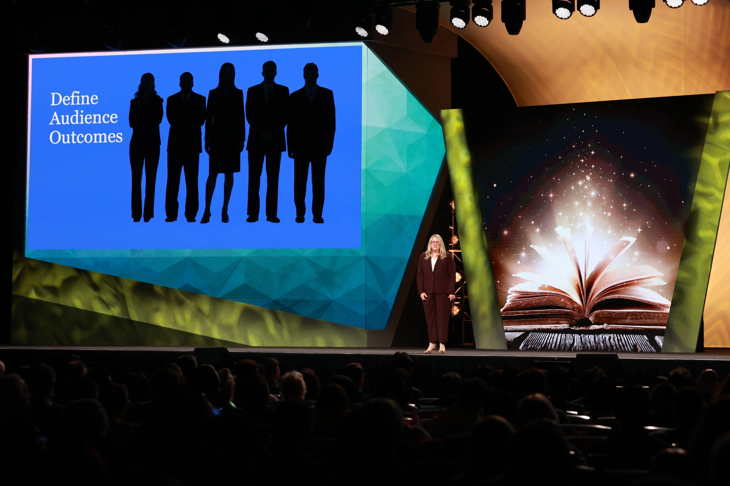 Karen Eber giving a storytelling with data keynote on a large stage