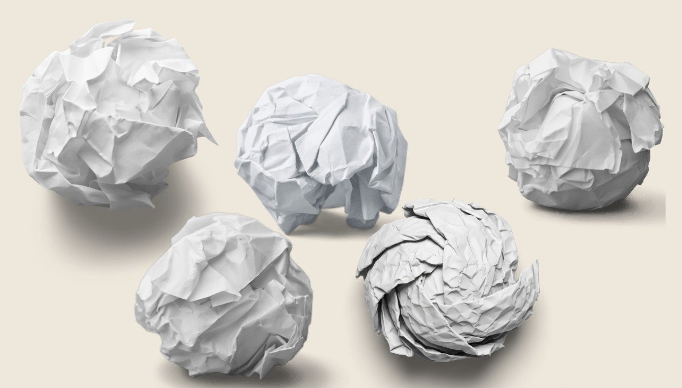 five crumpled balls of paper