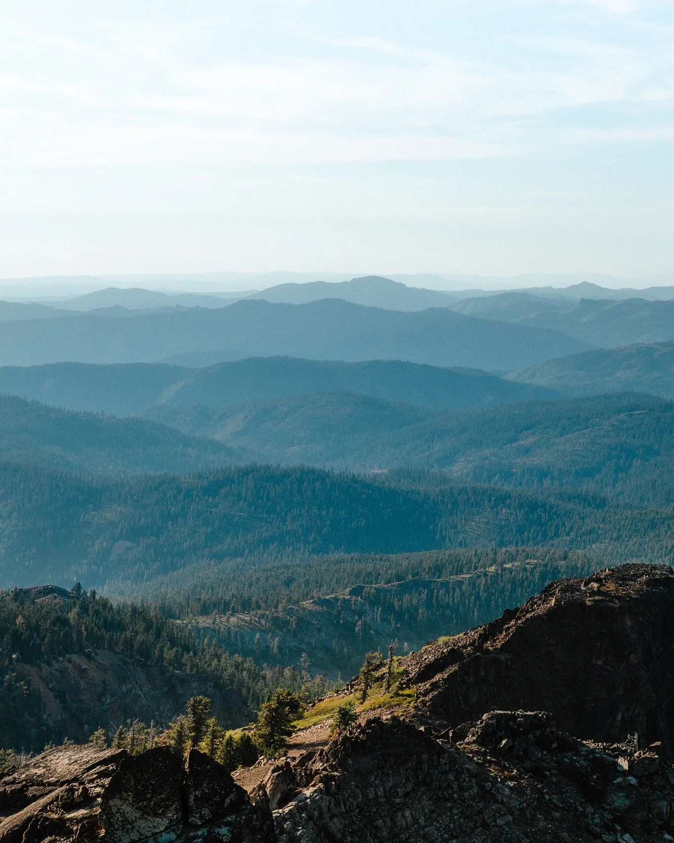 Looking out from the Sierra Butte Fire Lookout, the Sierra Nevada stretches in every direction &mdash; ridge after ridge fading into the horizon. The elevation, the light, and the scale of the landscape make it one of the most spectacular viewpoints 