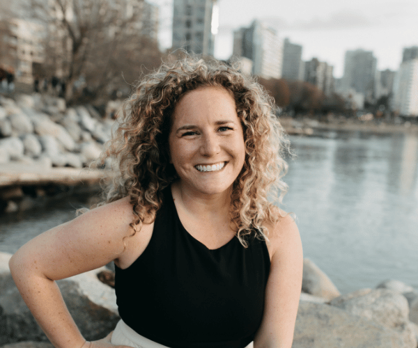 Close-up headshot of Lisa Michaud, wealth building coach and real estate investor entrepreneur, smiling and looking confident.