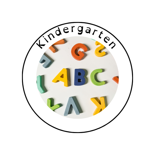 Colorful wooden alphabet letters scattered on a white surface, with "ABC" prominently placed in the center.