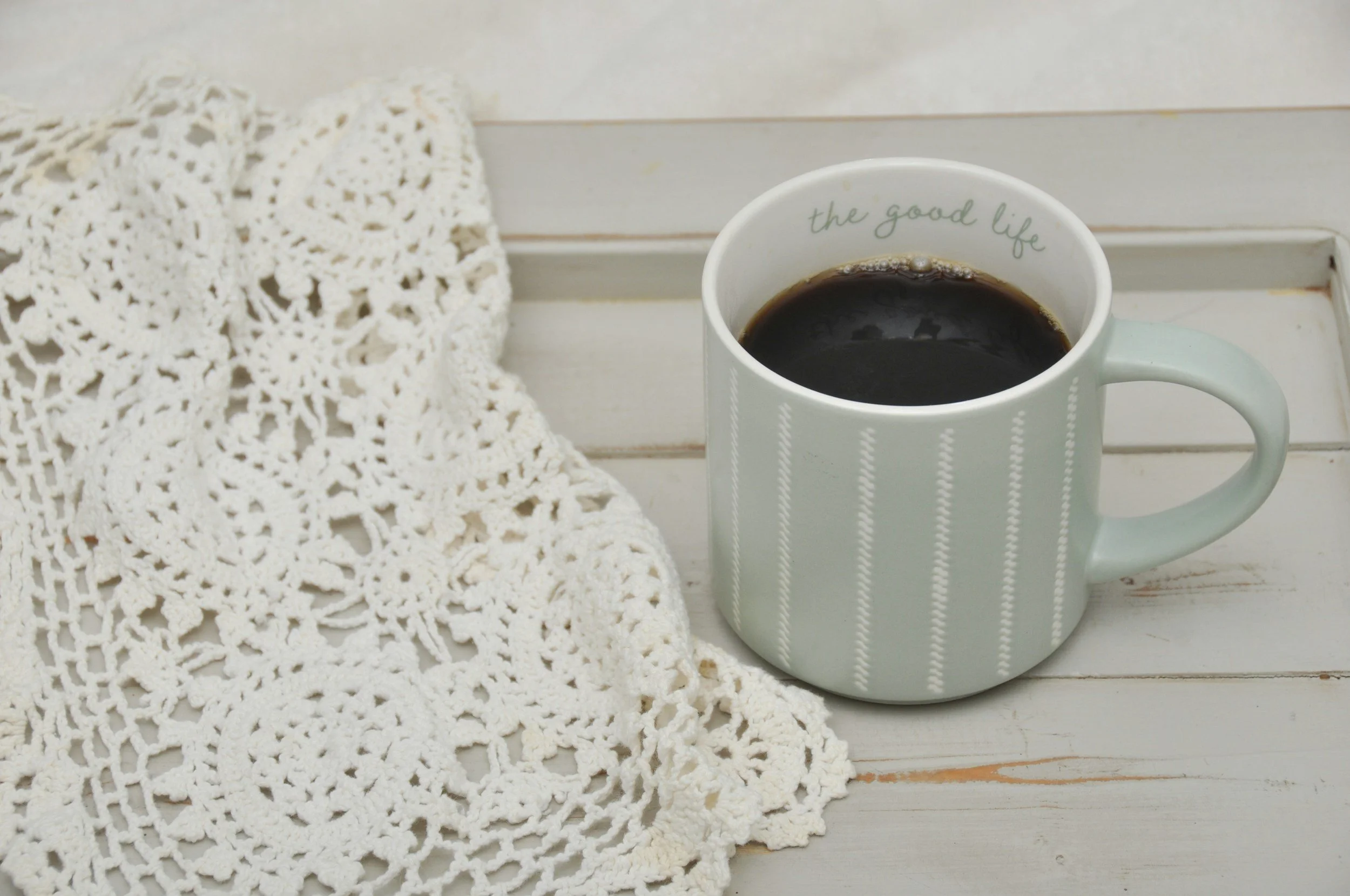 Doily and coffee cup
