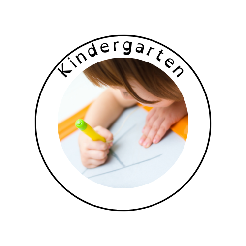 Child drawing with a green marker on paper