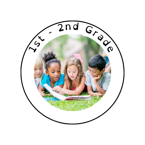 Children lying on grass reading a book together