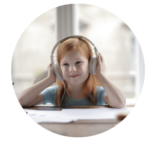 Young girl wearing headphones, smiling