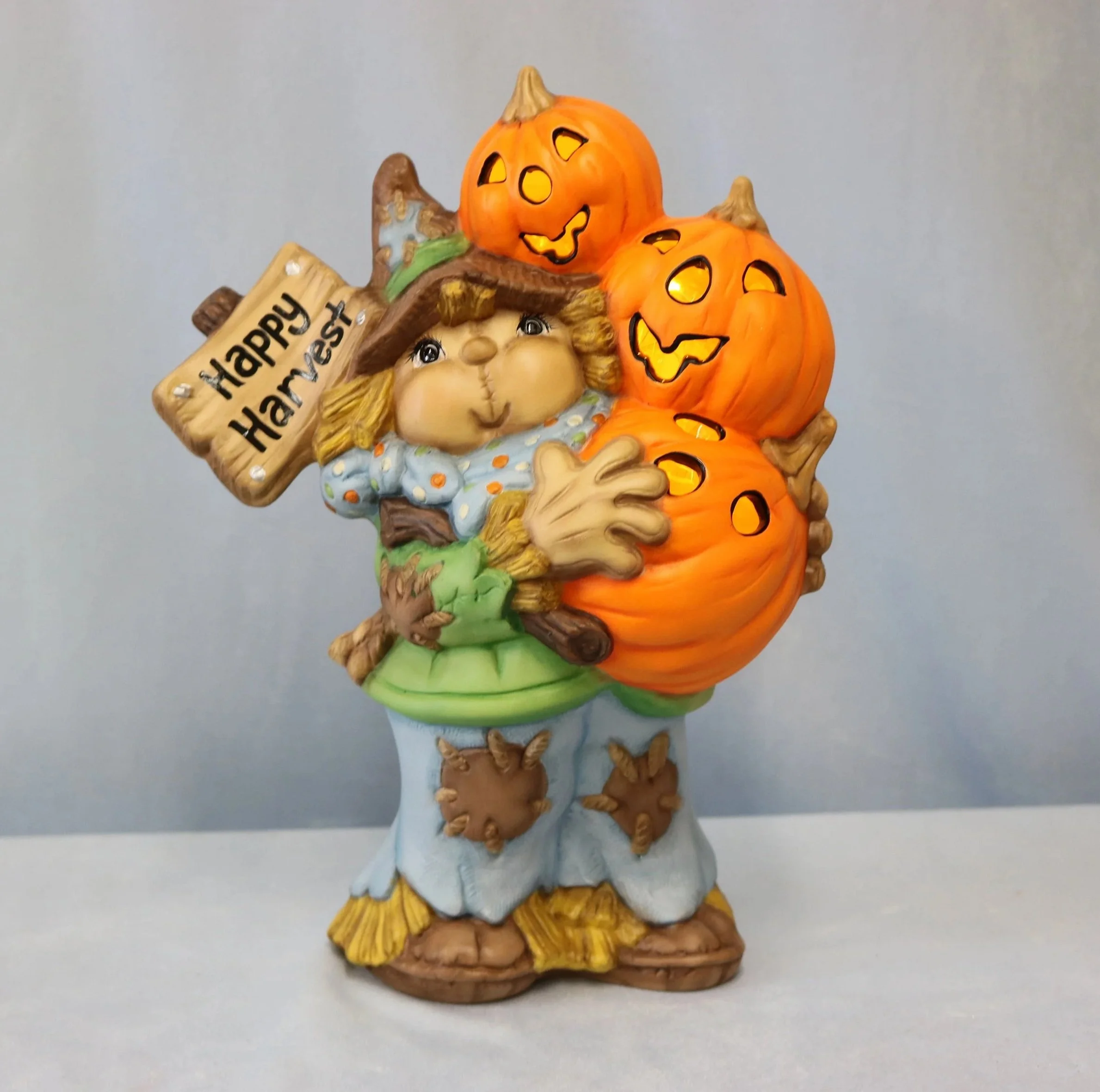 Scarecrow+holding+Pumpkins.jpg
