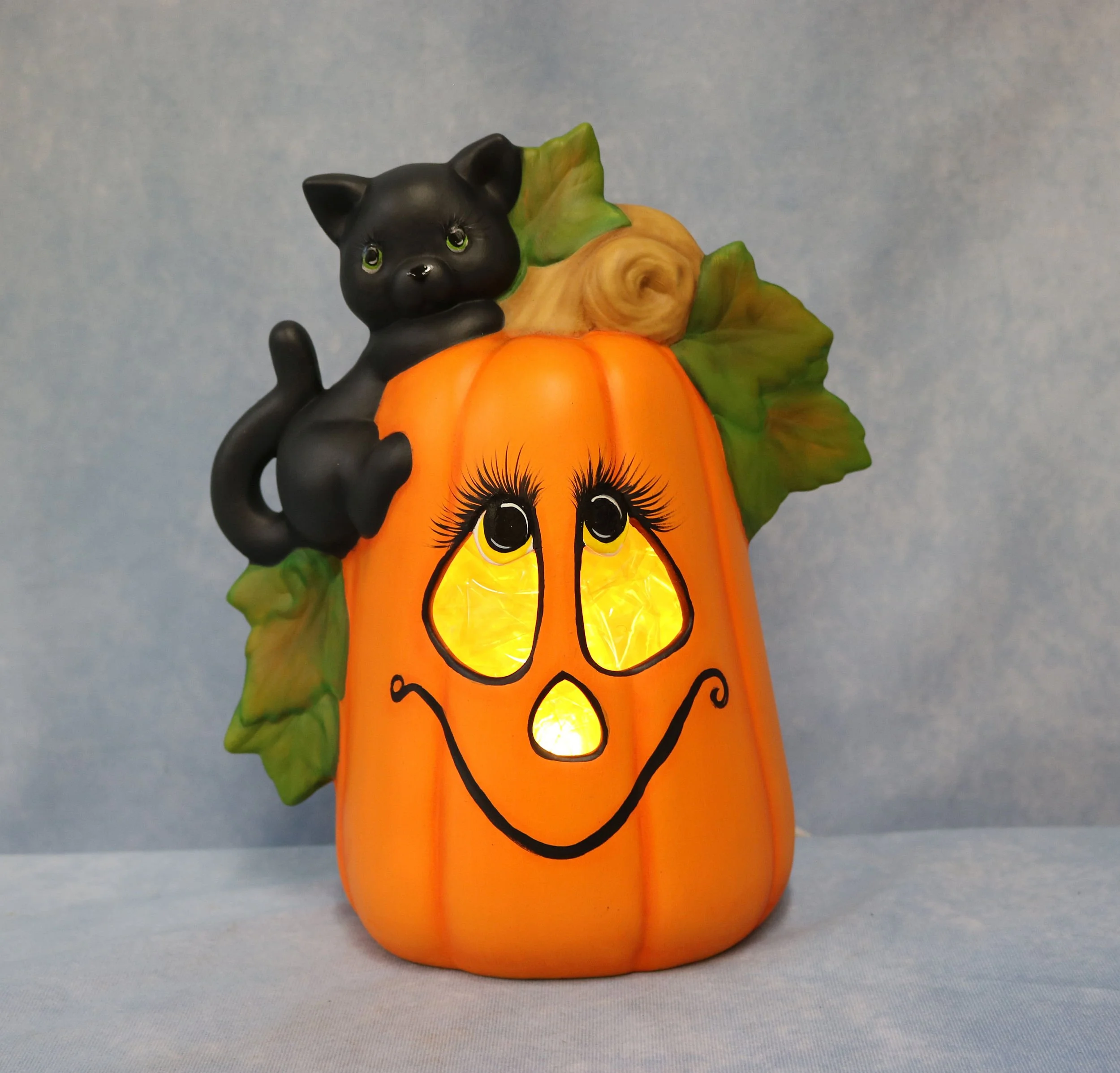 Black Cat Climbing Pumpkin