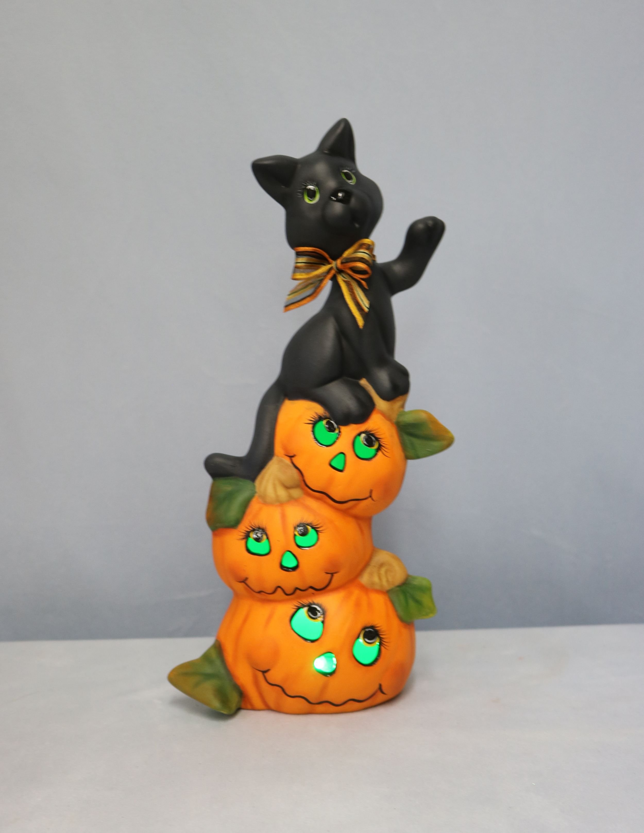 Black Cat on Pumpkin Stack