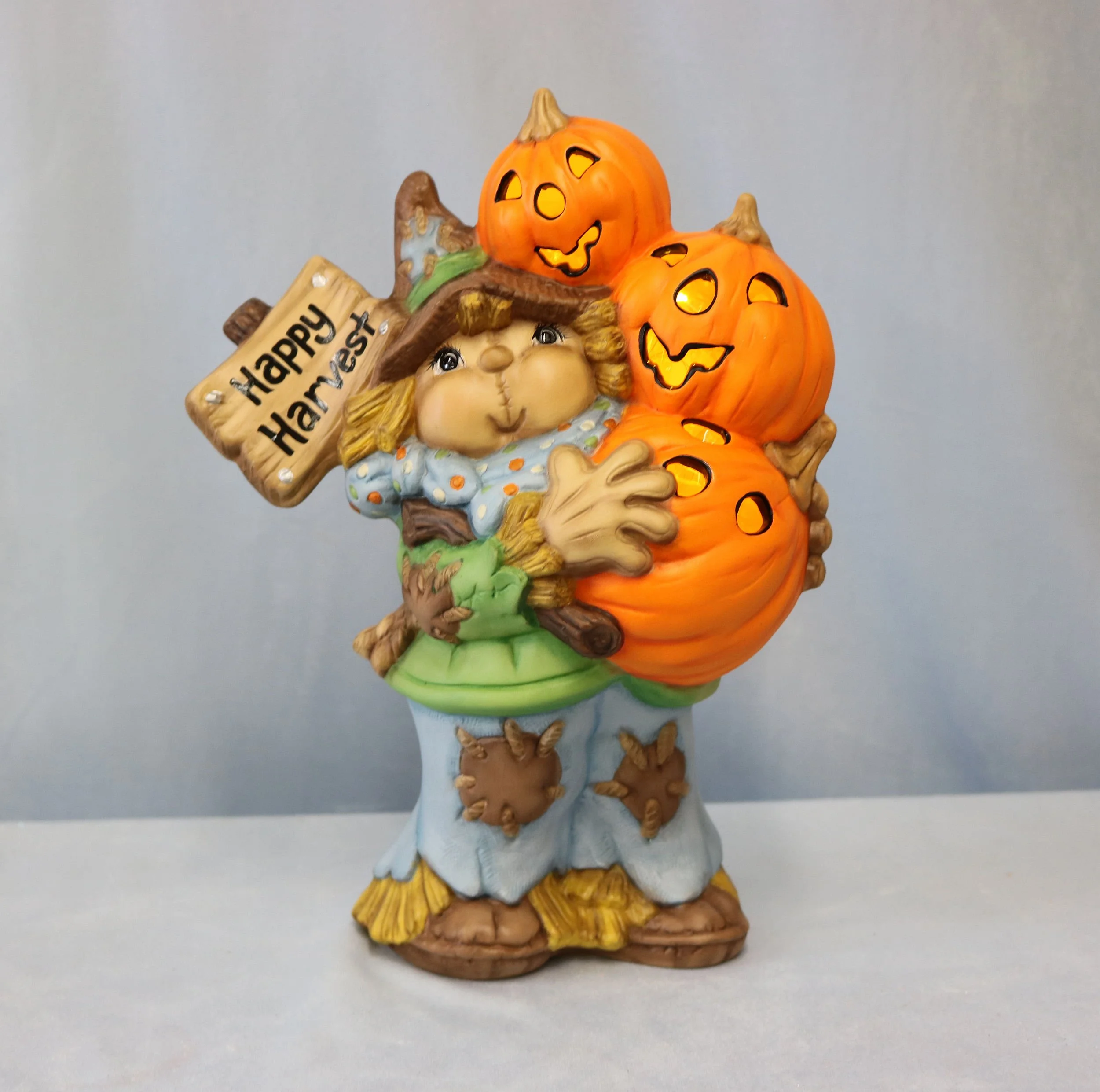 Scarecrow Holding Pumpkins Ceramic