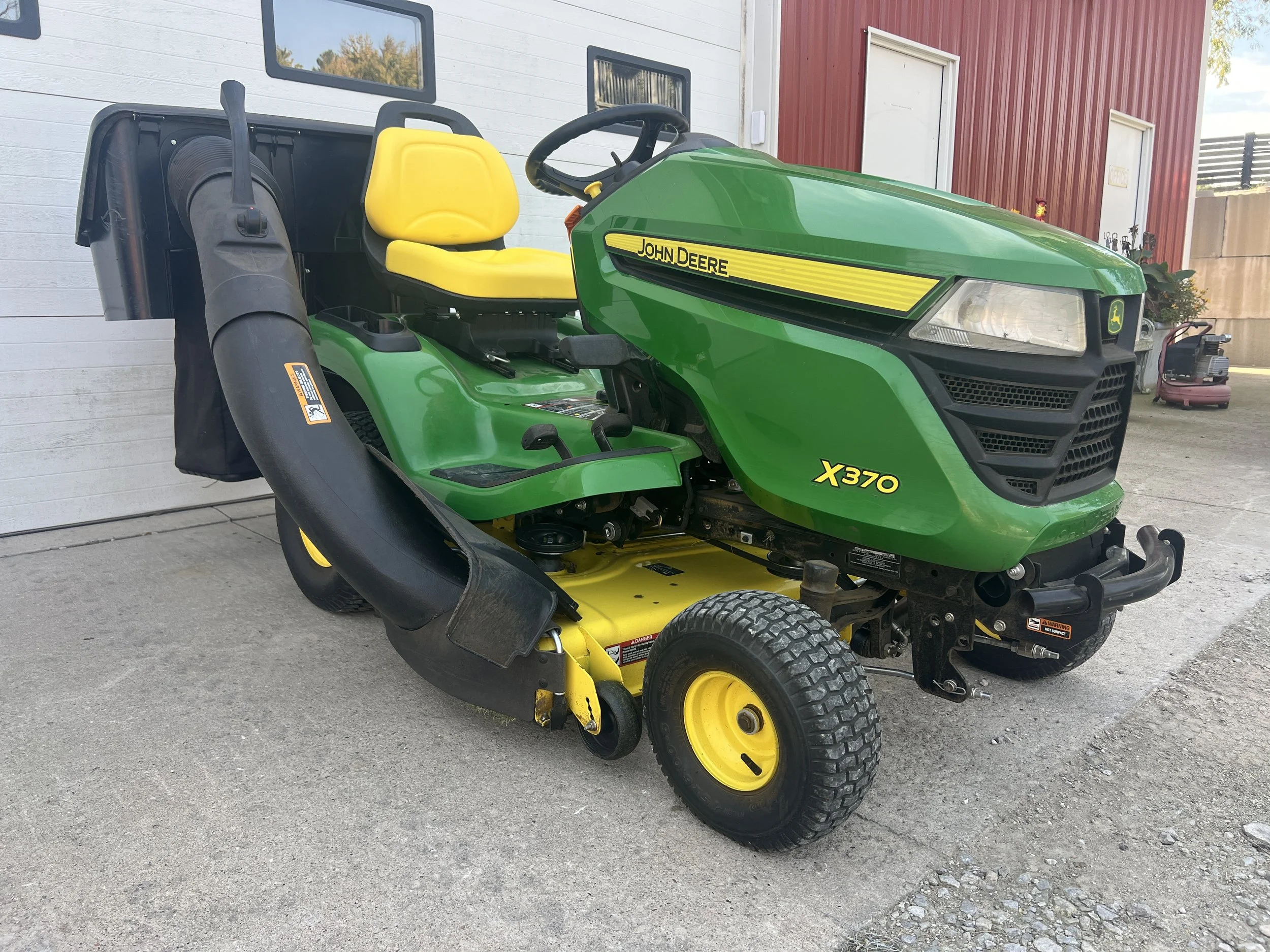 2016 John Deere X370 tractor 42" deck with bagger 298 hours. Power steering and lift. $3999