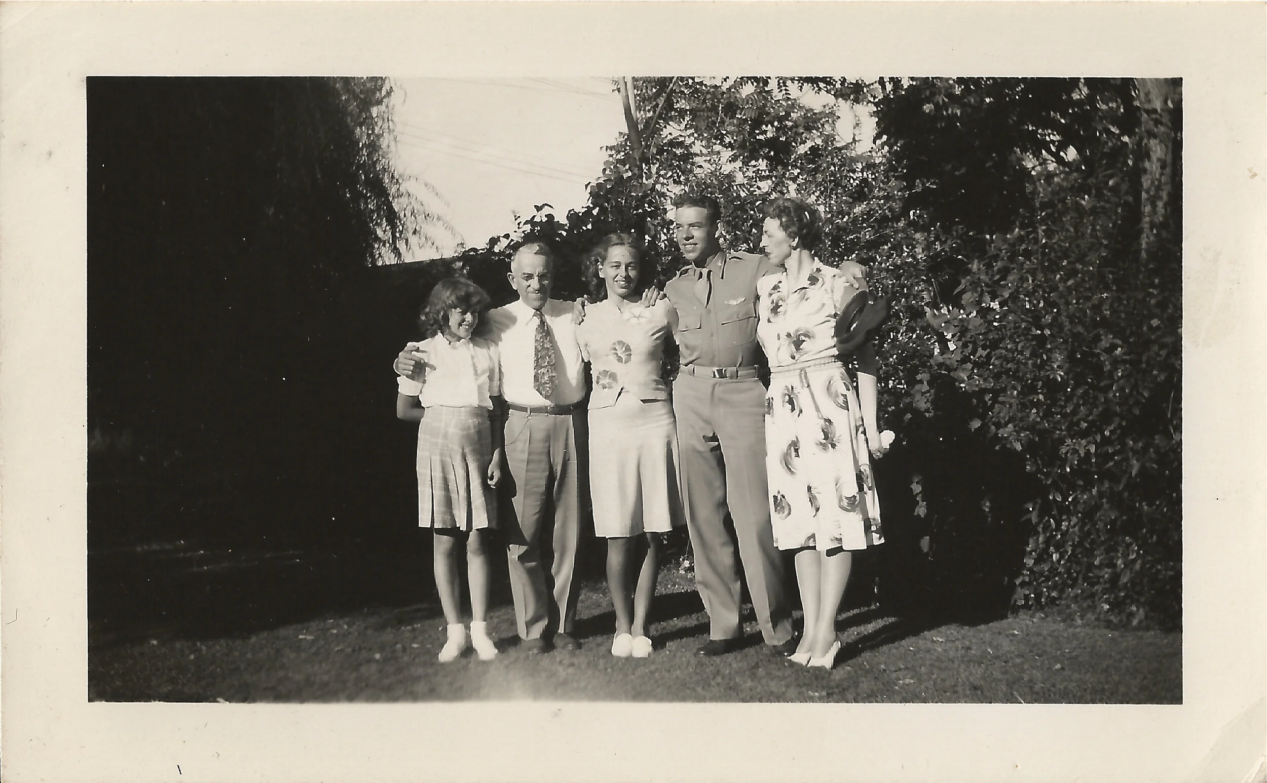 With Parents and Sisters in Uniform.jpg