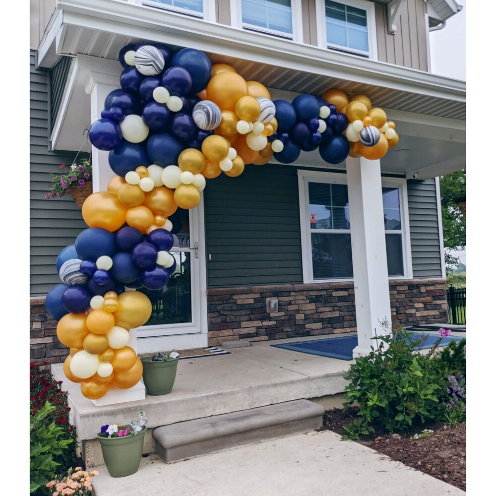 organic balloon arch on front porch rockin robot party co.jpg