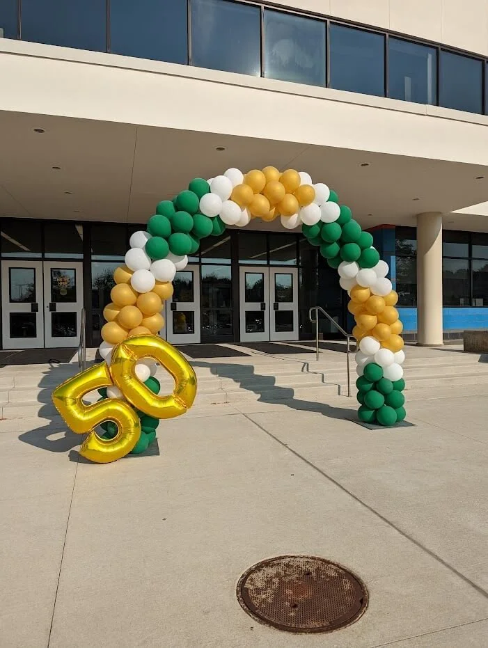 Balloon arch in CMU colors for a campus graduation ceremony.