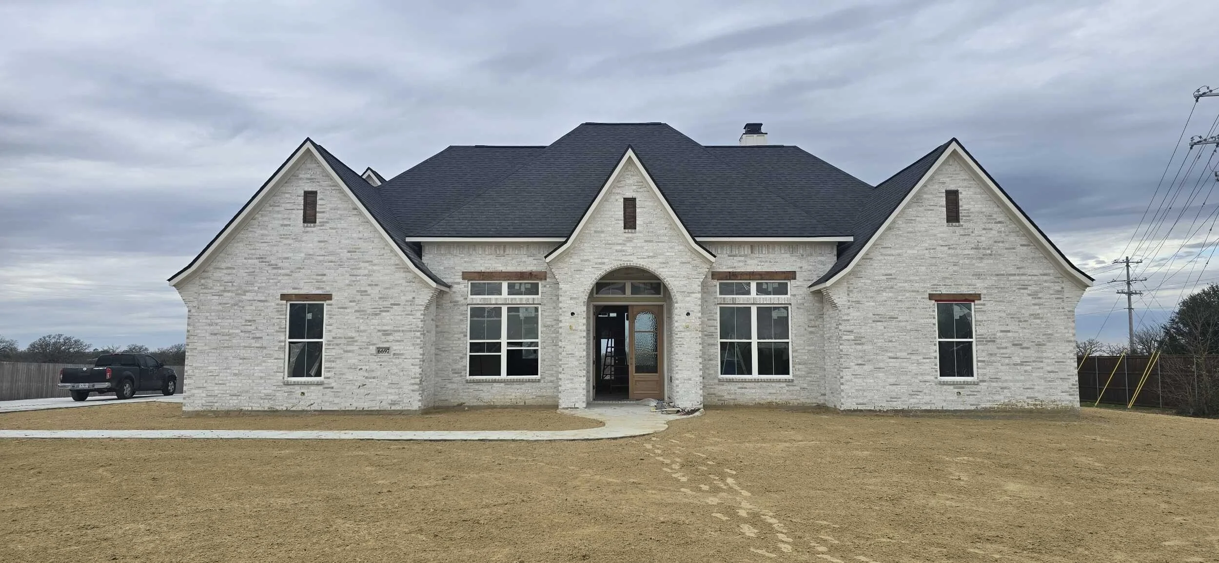 New Construction Home by Ridgewood Custom Homes in Ridgeview Estates, Snowmist brick