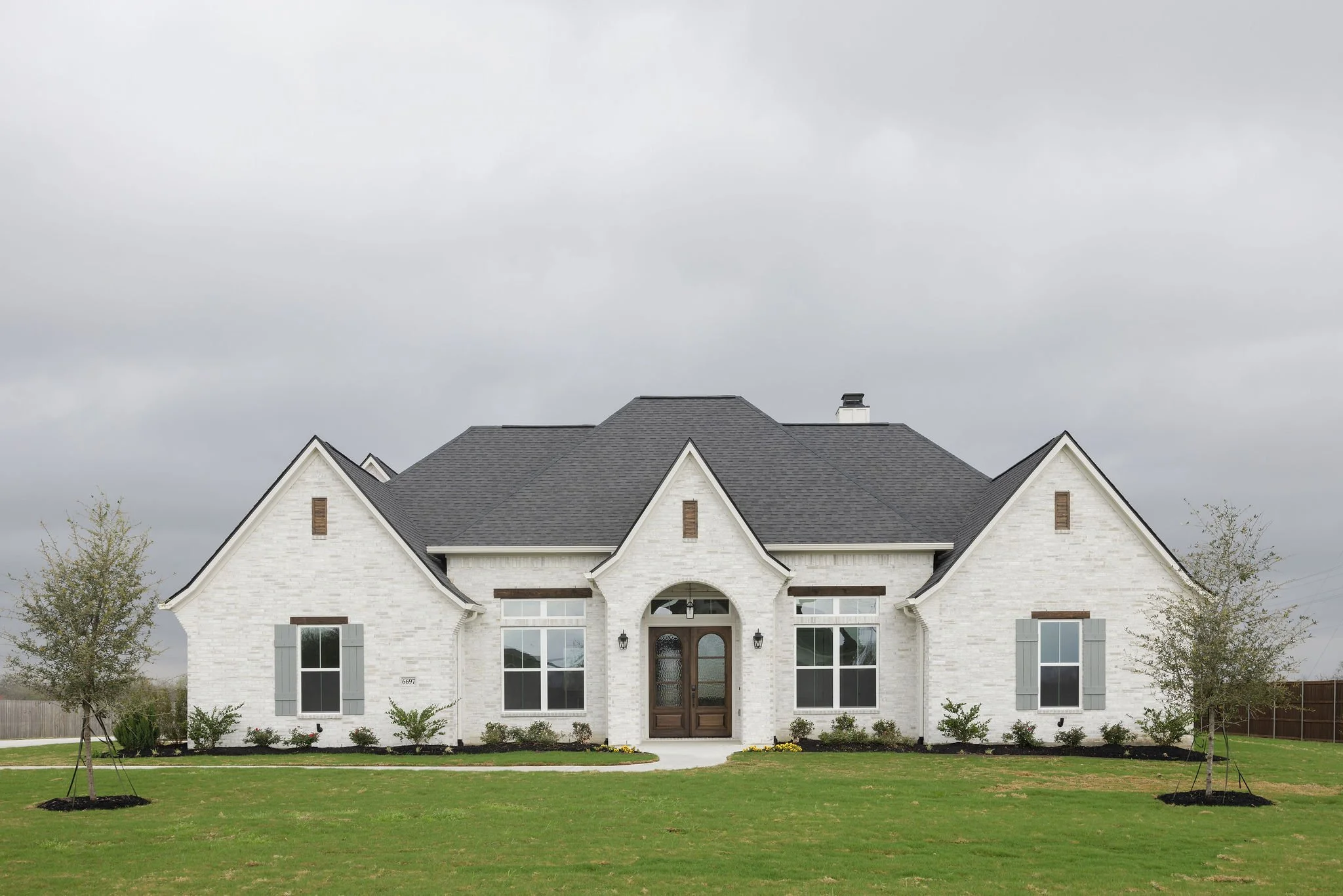 New Construction Home by Ridgewood Custom Homes in Ridgeview Estates, Snowmist brick