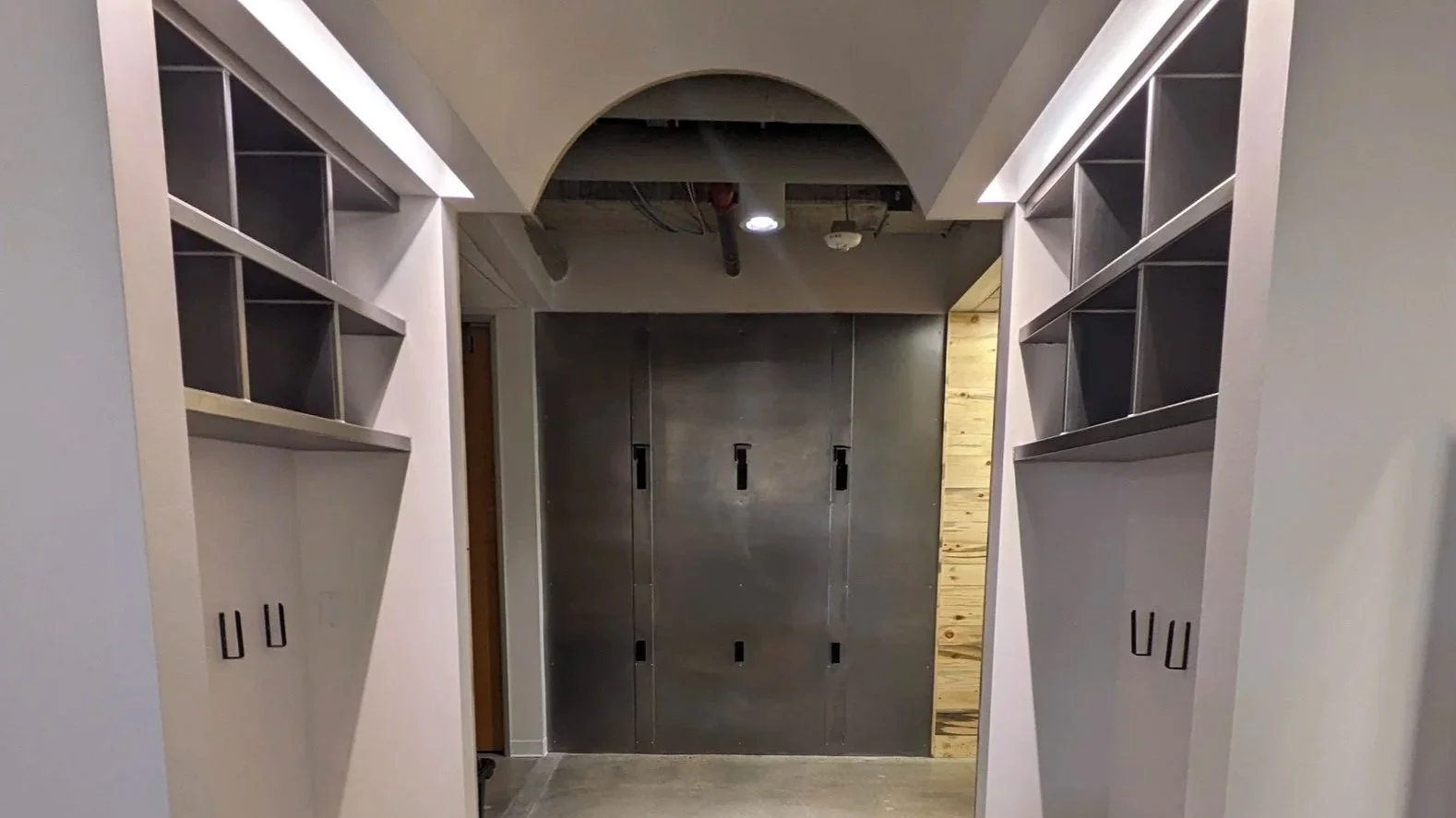 Metal wall panels and metal clad book shelves