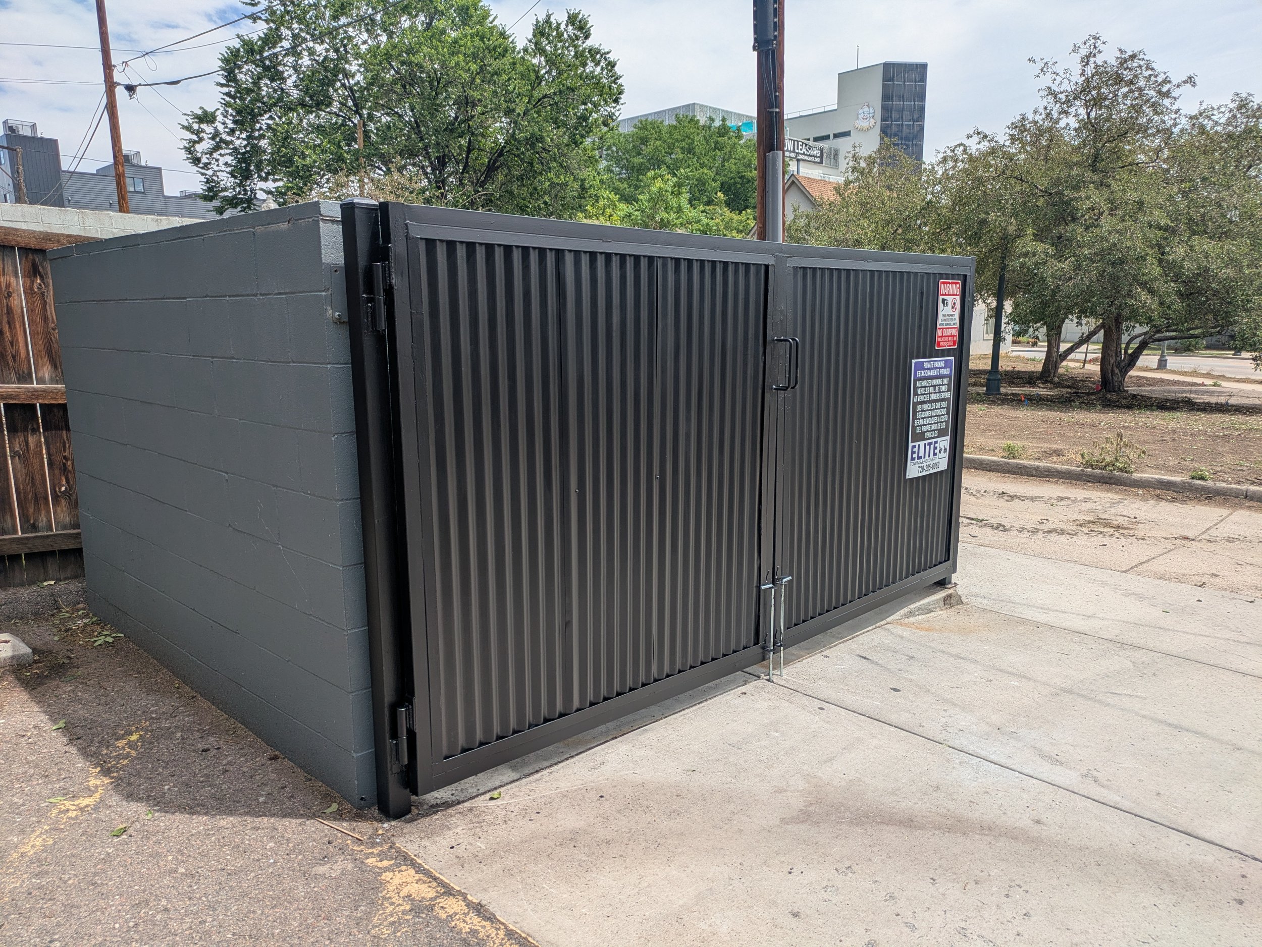  "after" photo of some dumpster enclosure doors. They were heavily damaged and needed new hinges, latches, panels, and handles.