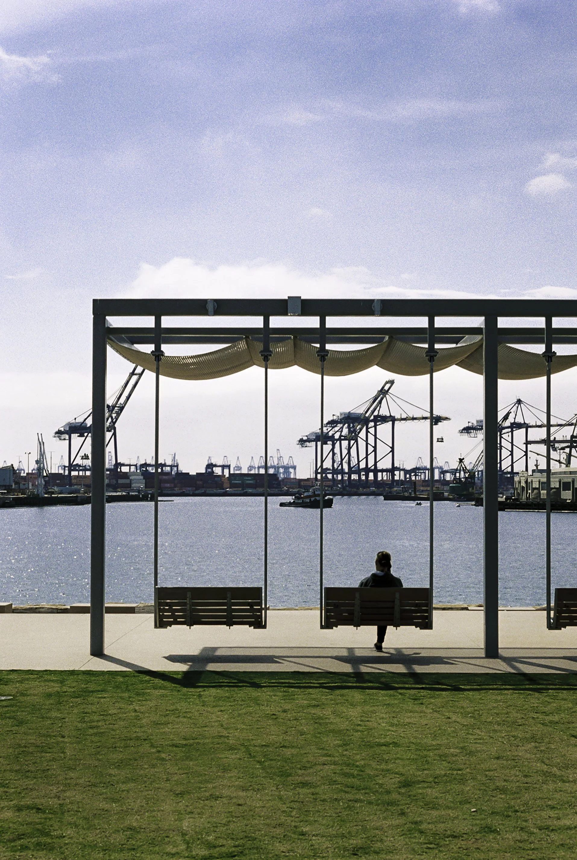 Person sitting on bench at pier.JPG