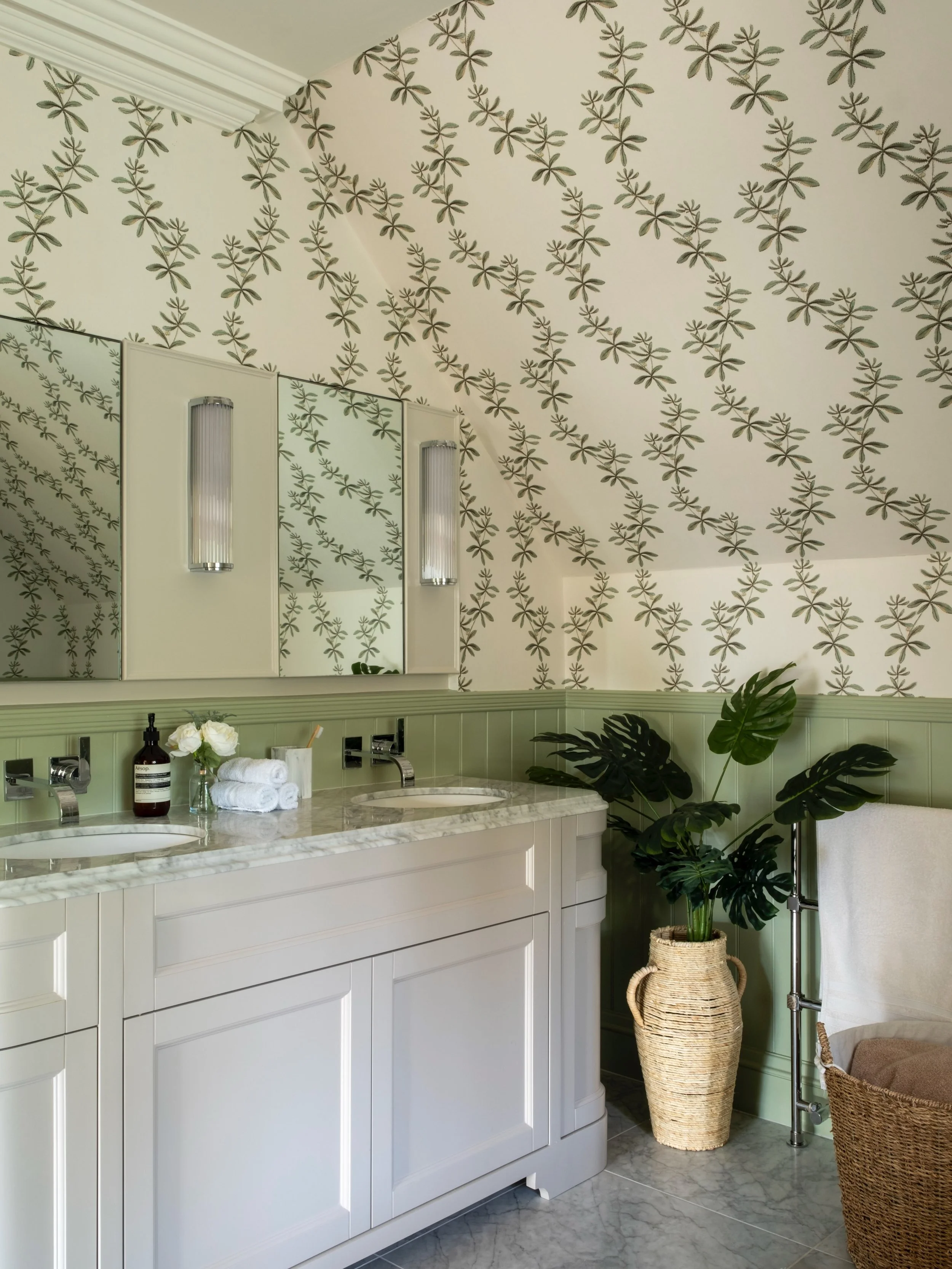 Resharing this dreamy Surrey bathroom we completed. The use of crisp Cararra marble, whimsical wallpaper and gentle green transformed what was previously a cold bathroom, into a truly welcoming retreat. Who wouldn&rsquo;t want to indulge in a bubble 