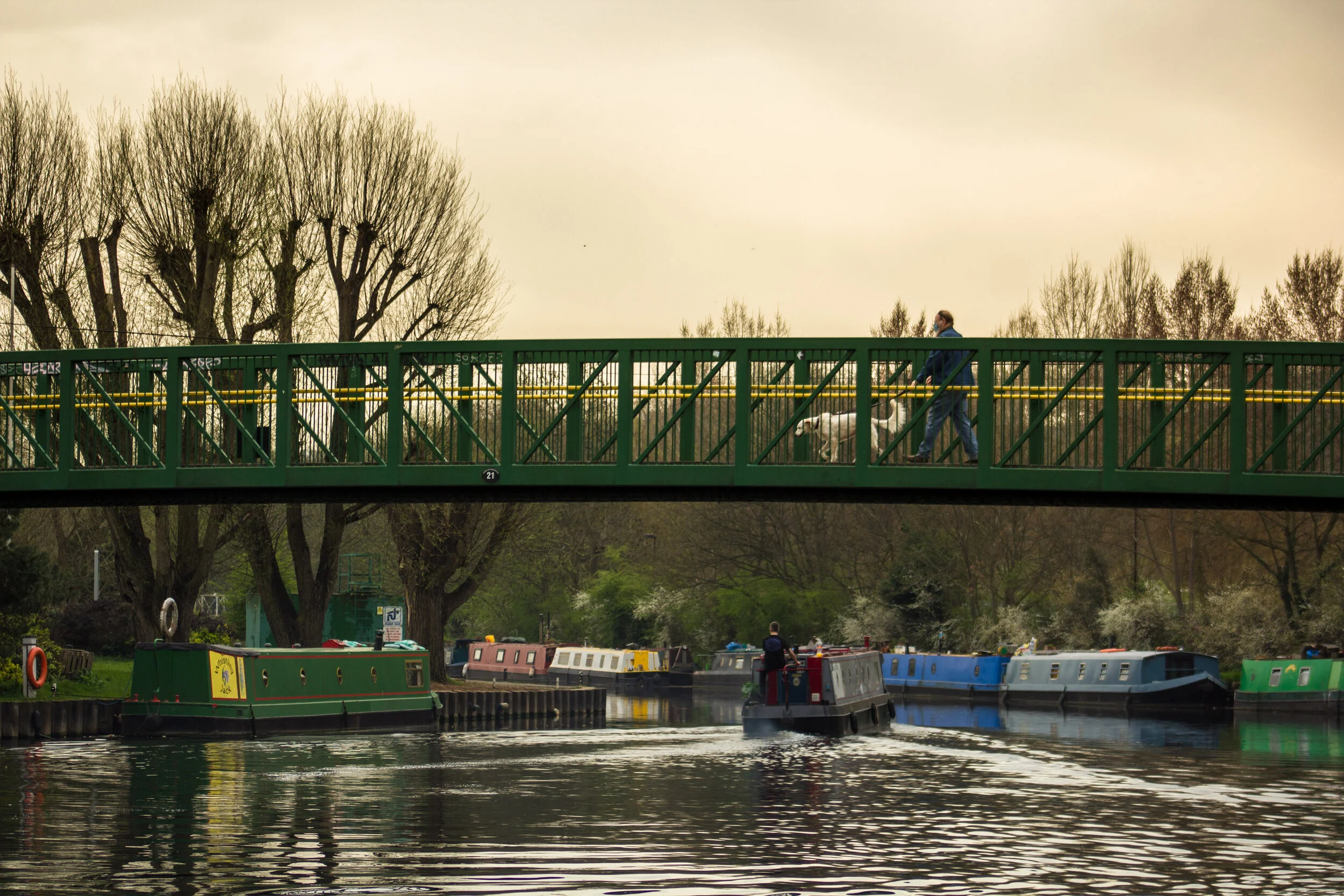 colorful boathouses dotted the river banks
