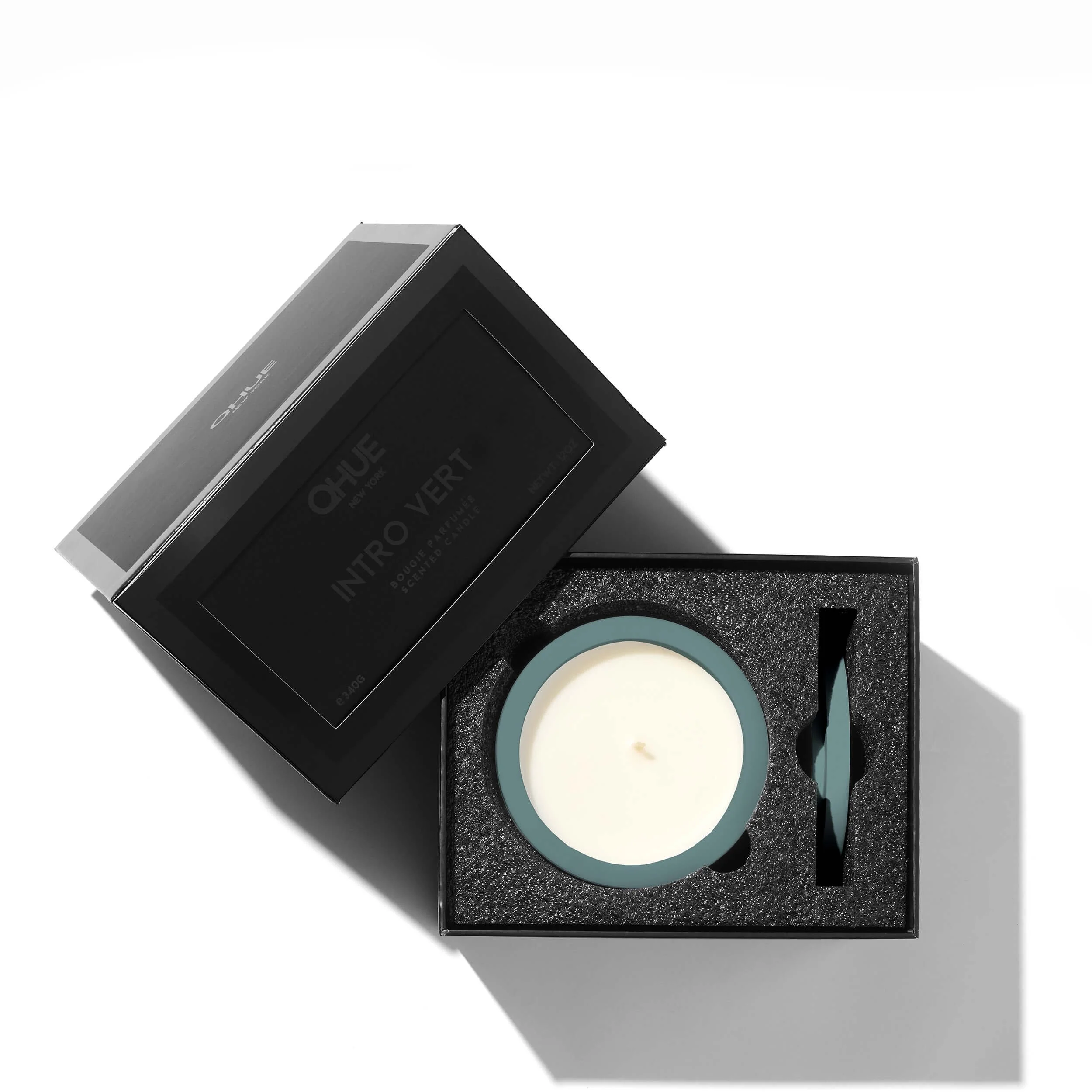 Intro vert candle packaging, a sleek black gift box by Qhue New York
